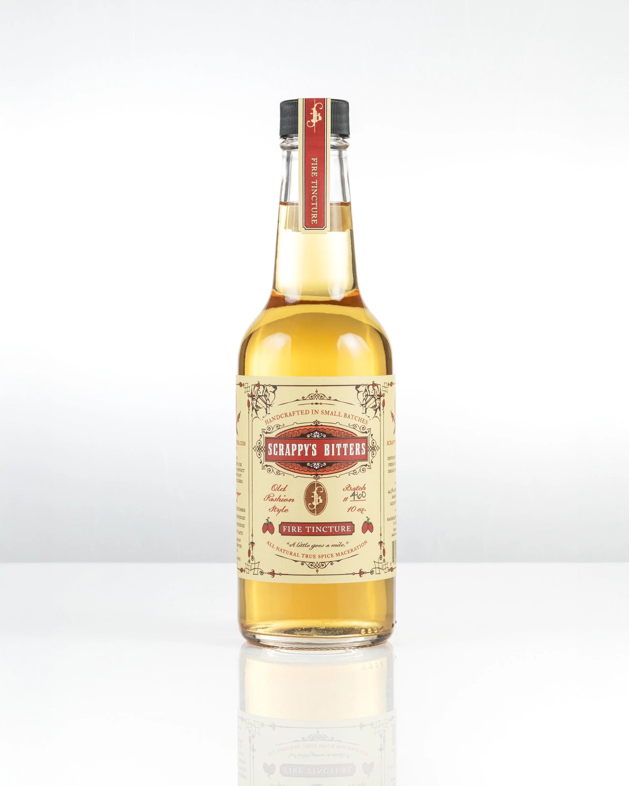 Scrappys Bitters_Fire Tincture 10oz_with reflection - V2.jpg