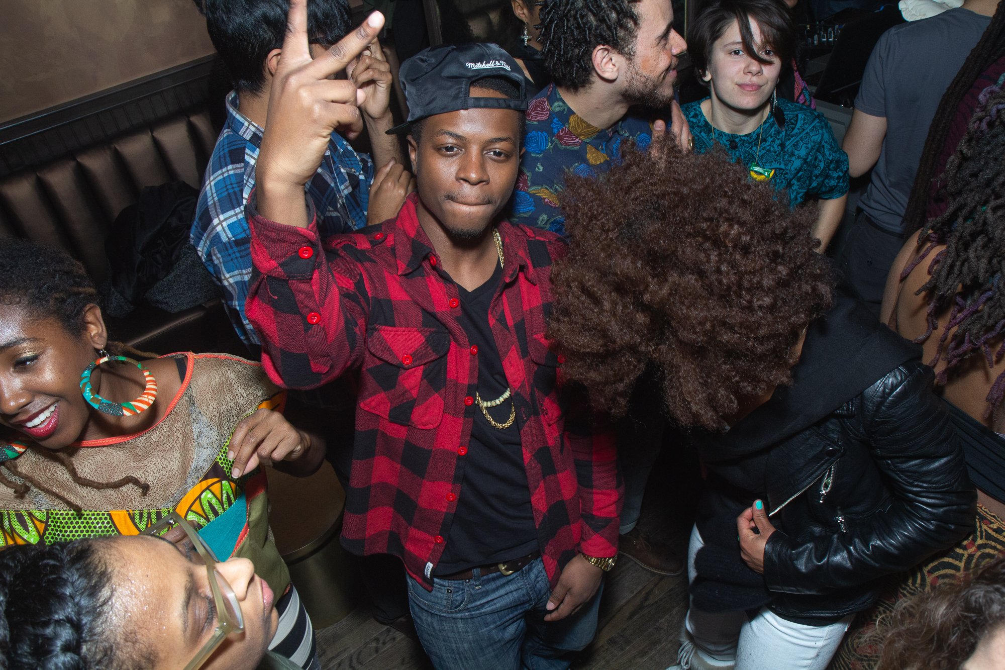 Crowd celebrating at Louie and Chan's The 303 club in Manhattan