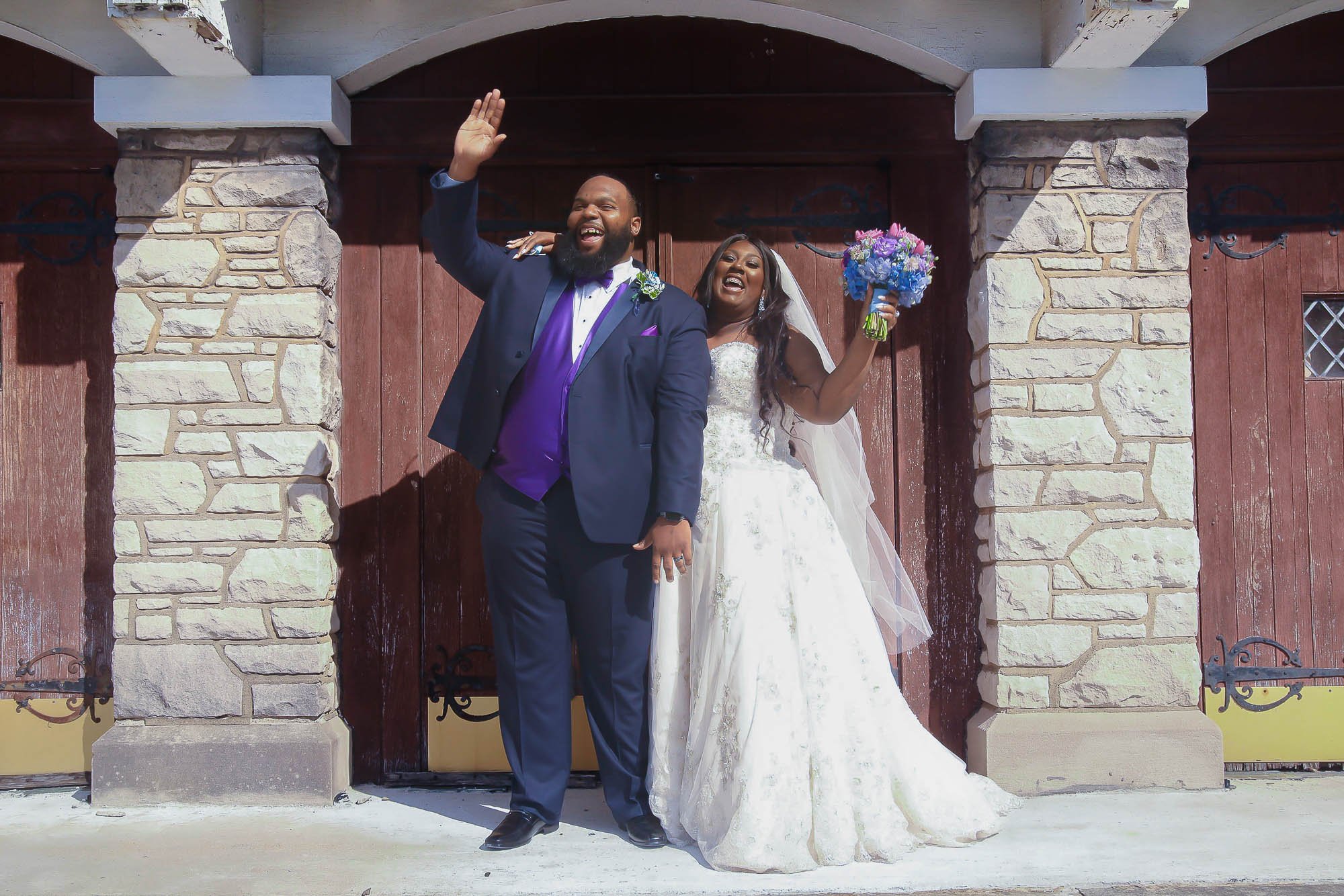 Captured in St. Louis, Missouri, in 2020, this poignant image immortalizes a heartwarming moment during William and Mia's pandemic wedding. Against the backdrop of a charming chapel door, the American-African couple stands united with radiant smiles,
