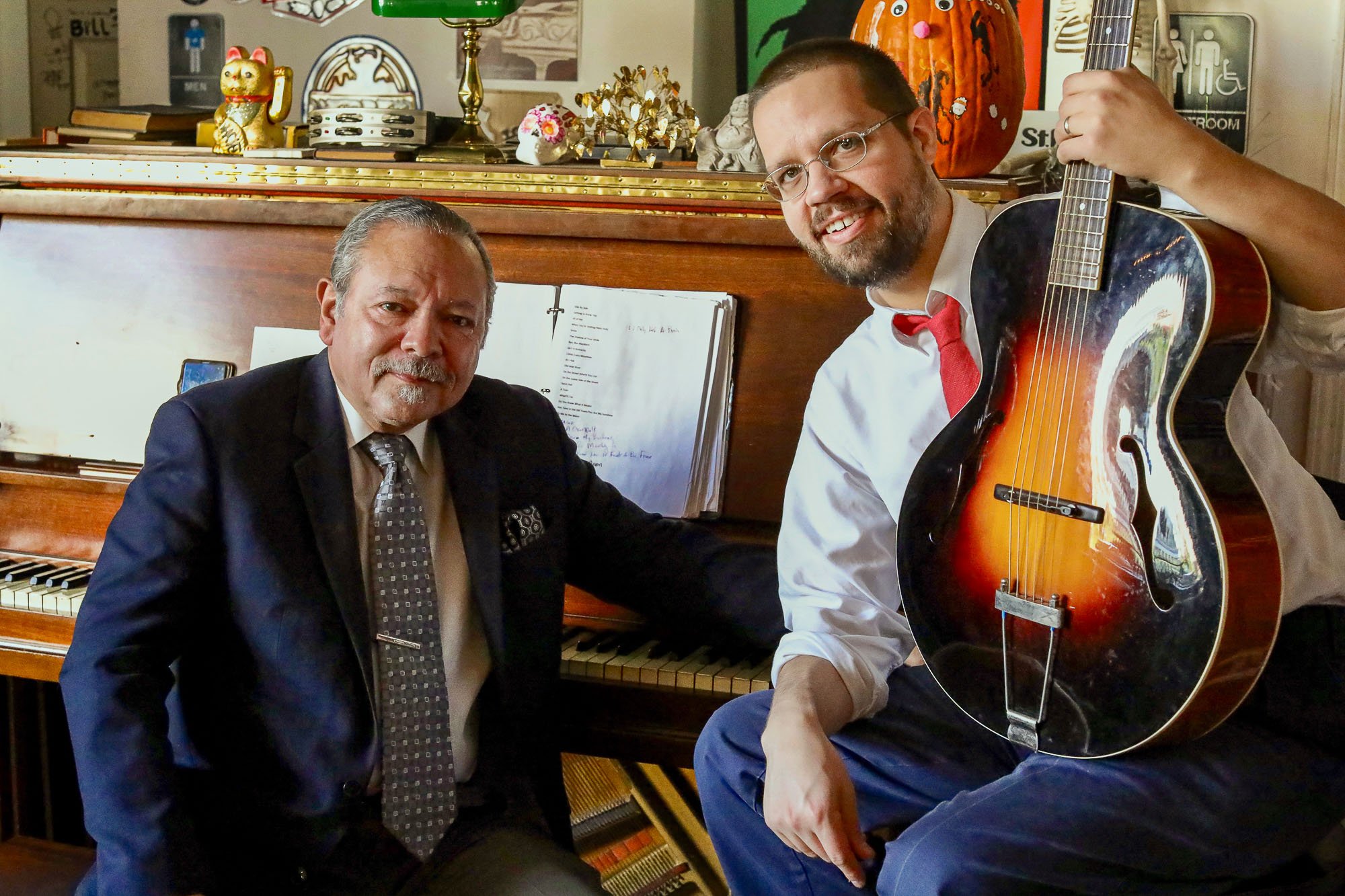 This enchanting image portrays a moment captured during the Cherokee Street Jazz Crawl weekend event on November 9, 2019, at the cozy setting of the Cherokee Pizza and Wine Bar in St. Louis, Missouri. Here, the musical synergy between music director