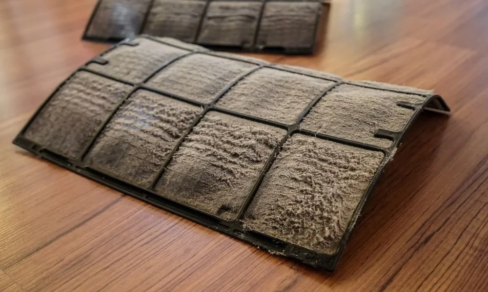 Dirty air filters of  heat pump on the floor