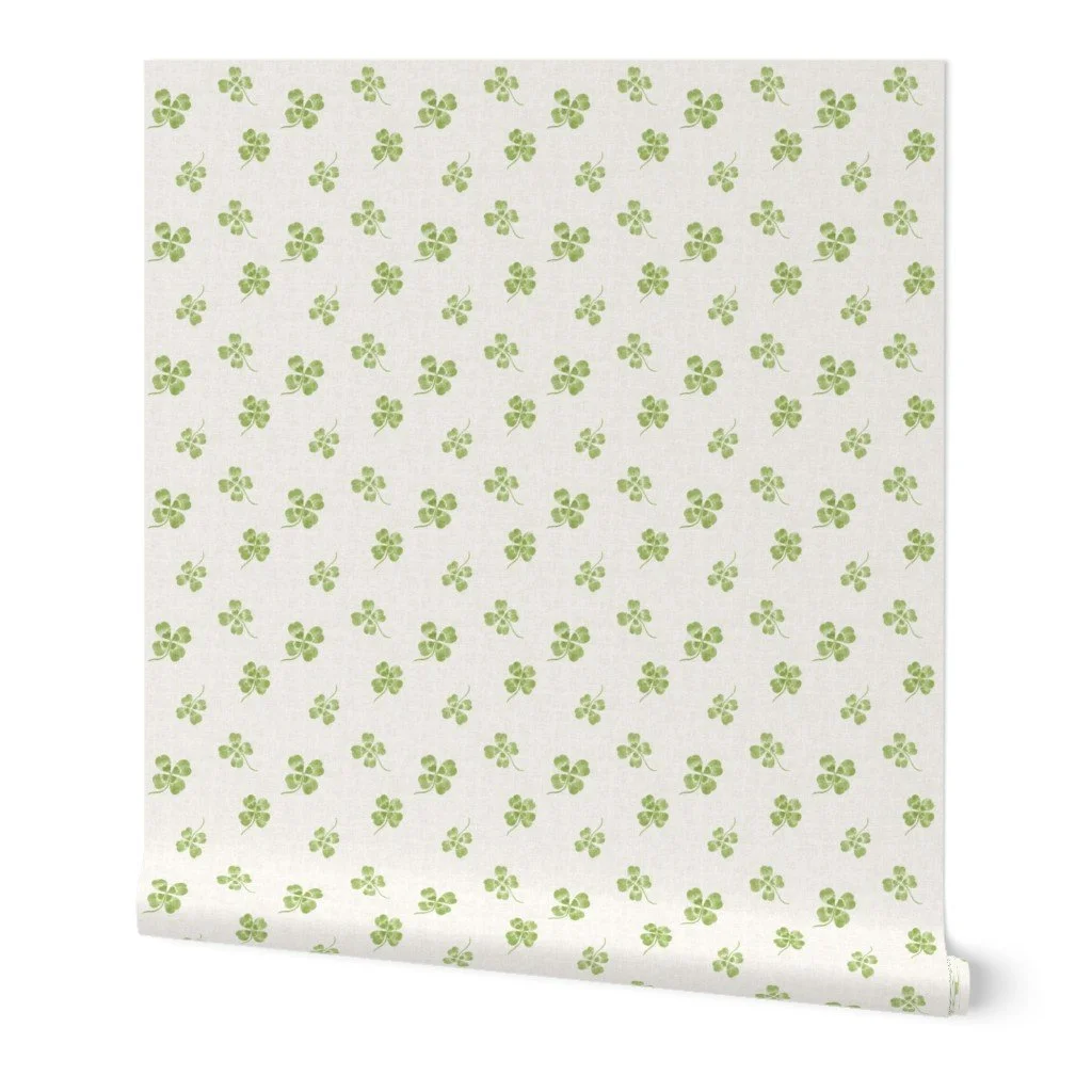 mini four leaf clover in green on soft cream linen background for clovercore interiors