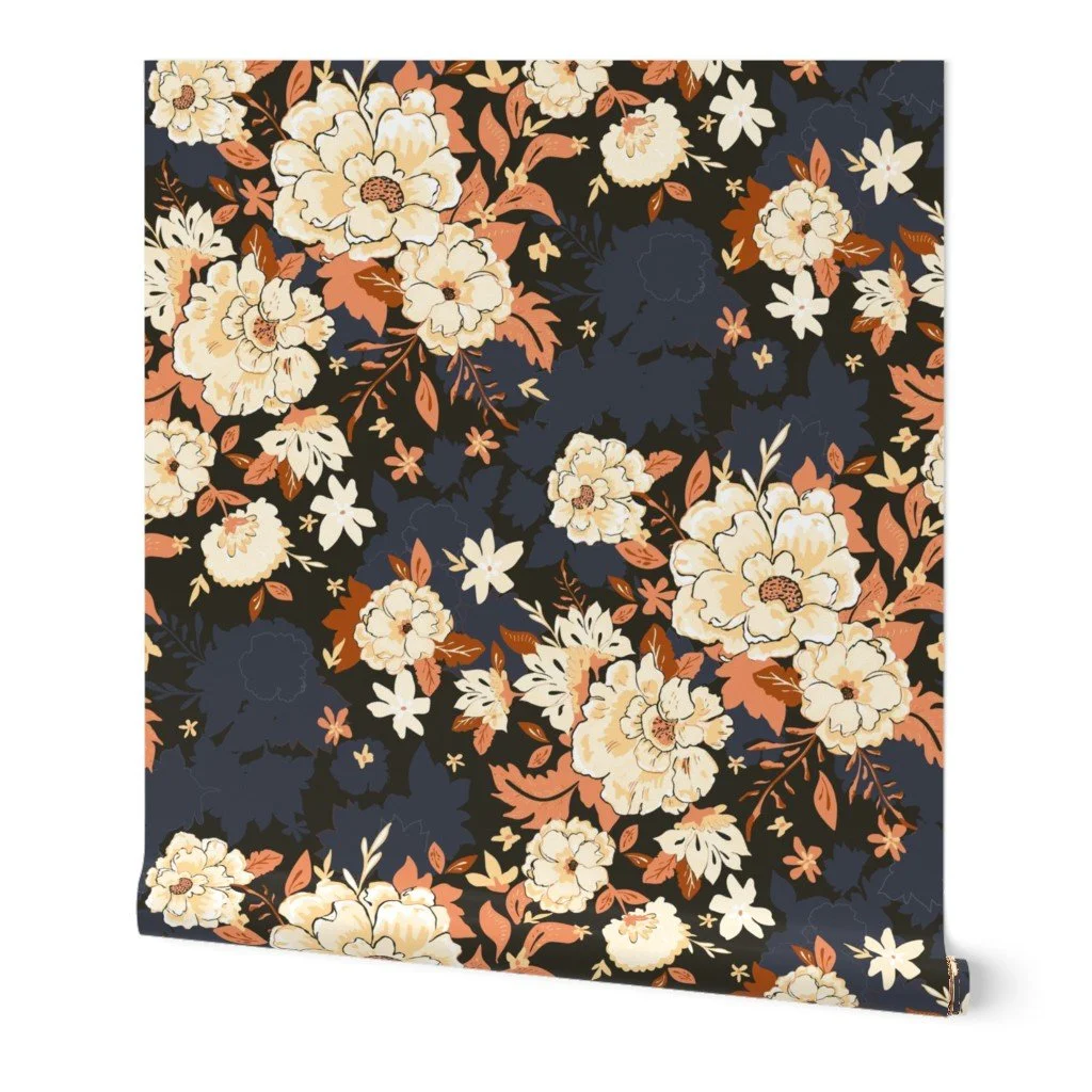 moody floral chintz in cream and brown on dark black background shown on wallpaper roll