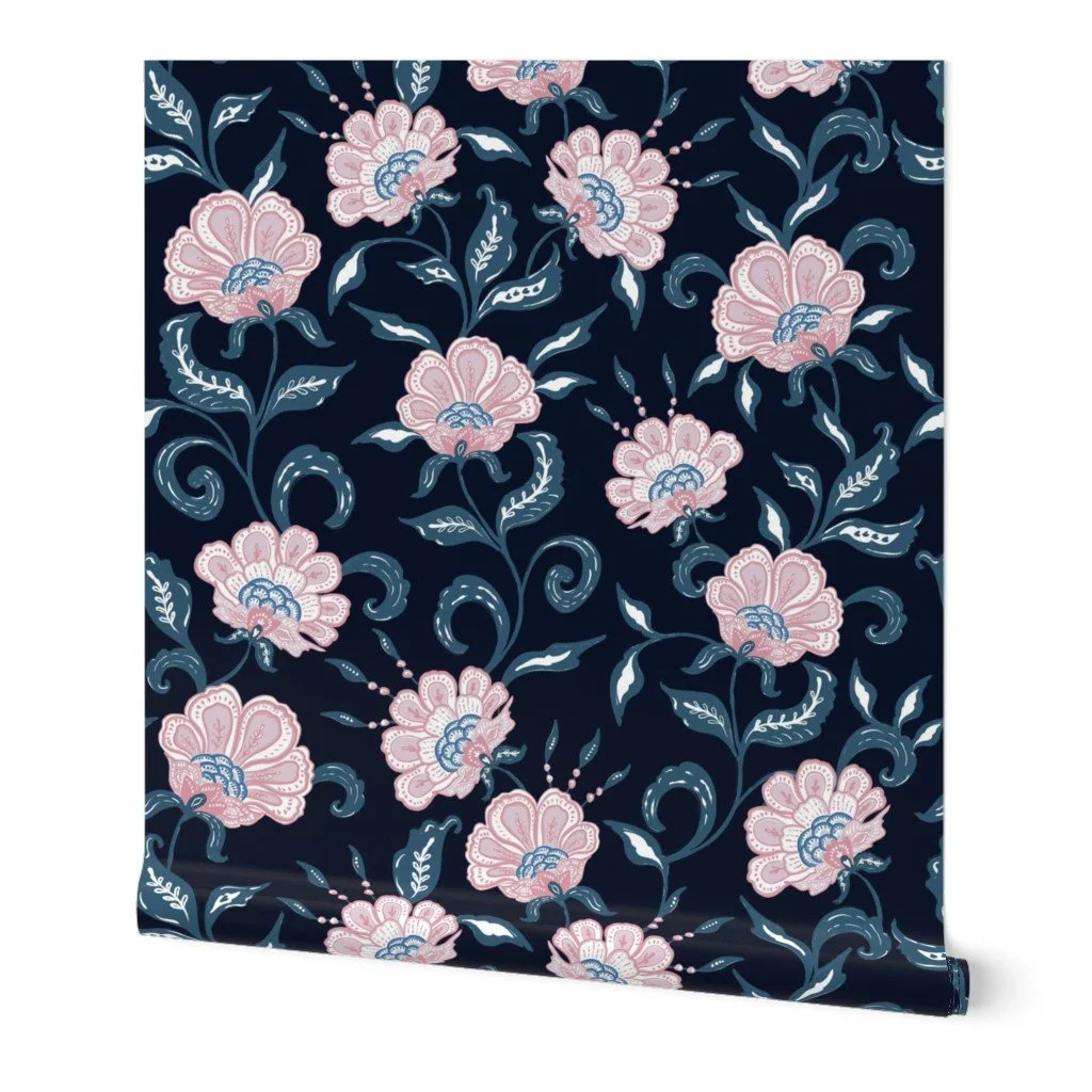 pink chintz floral on dark navy blue ground shown on wallpaper roll