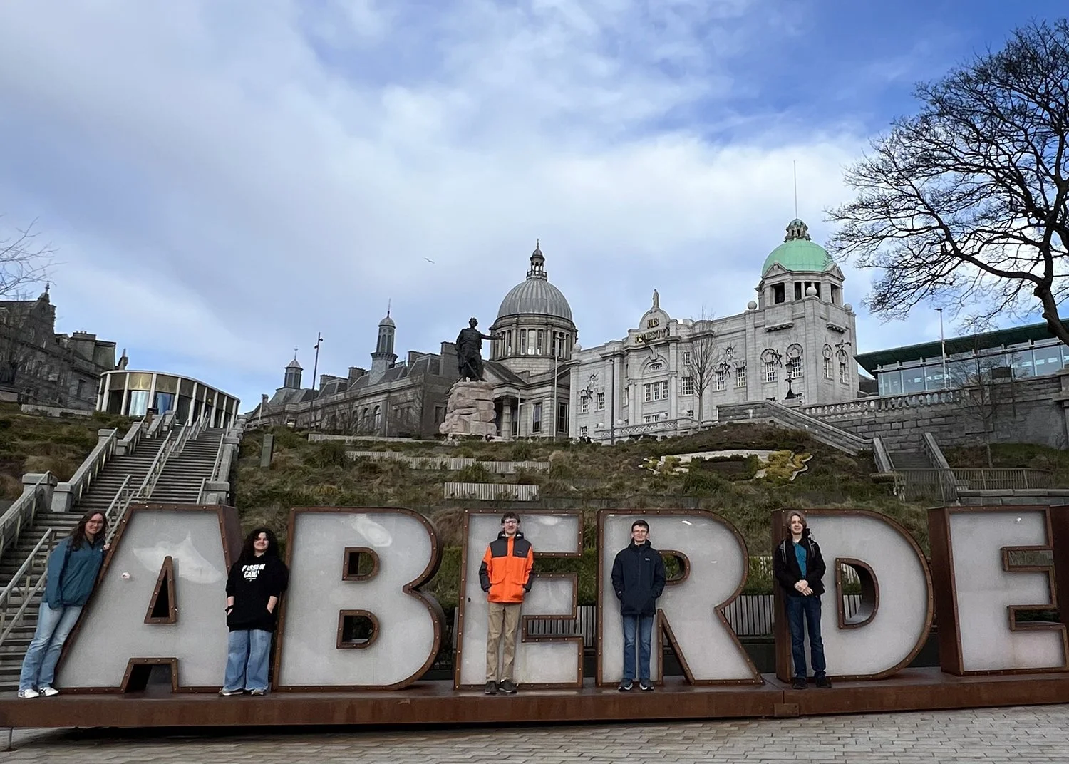 2026.03.11-15 - MS:HS Band AMIS Aberdeen - AMIS Aberdeen sign copy.jpg