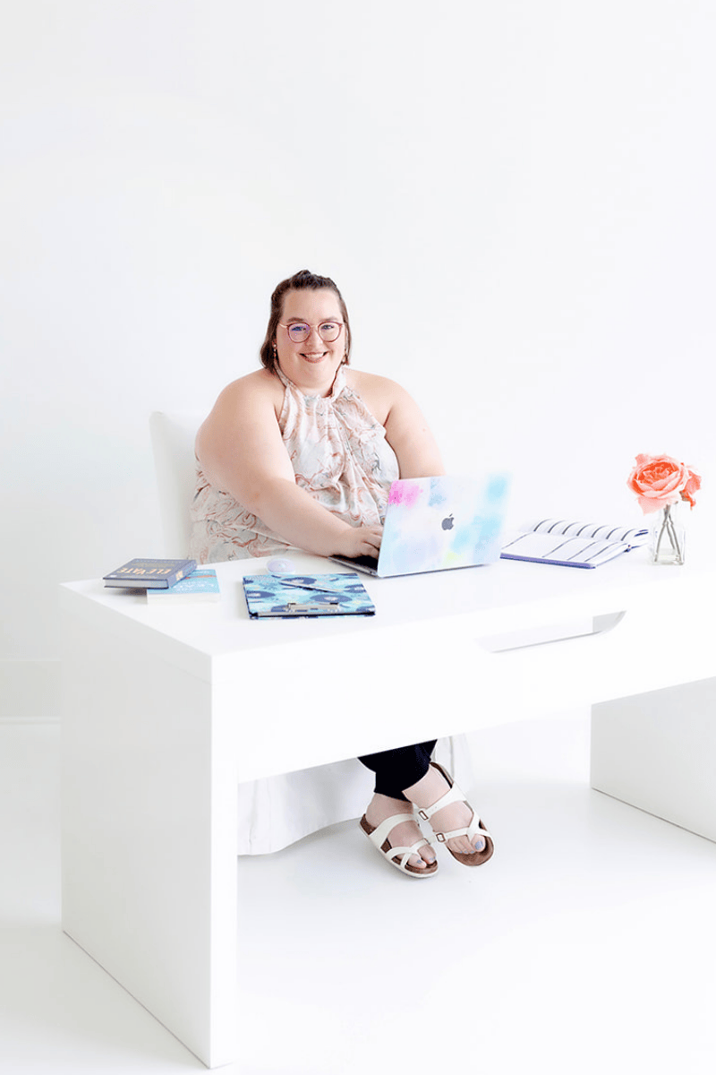 Sammy Bohannon sitting at desk on laptop