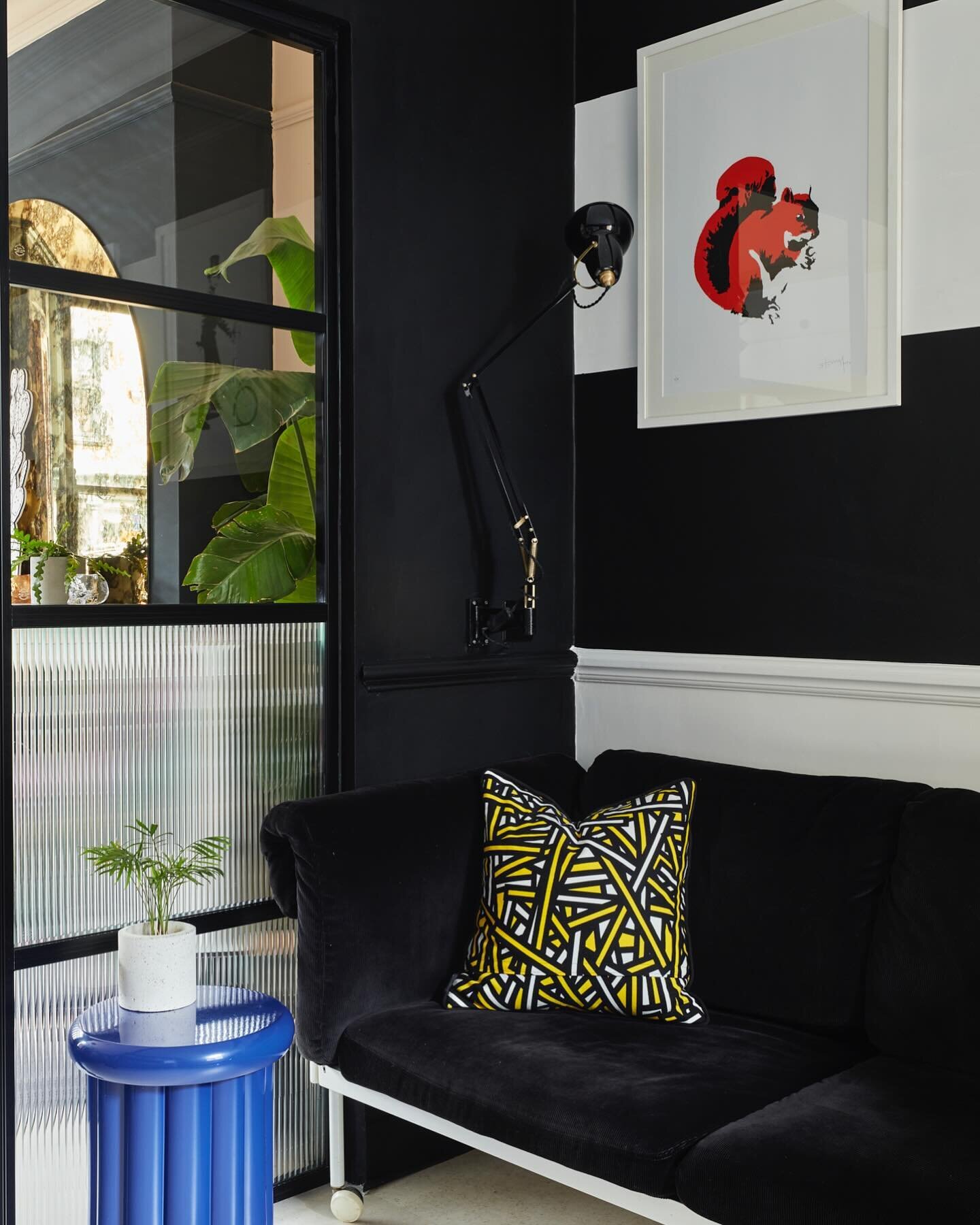 Most popular corner to cosy up in. The black is super enveloping and cocooning. 

Wall mounting the classic black and brass 1227 Anglepoise creates the perfect evening reading spot.

Utilising the power of reeded glass on the lower panels of the glas
