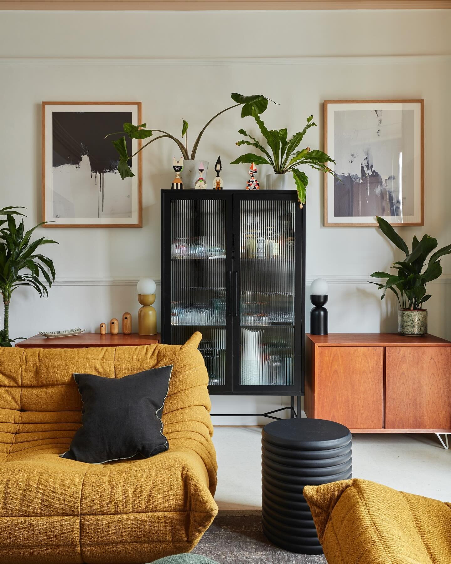 Mellow mustard and a generous shake of black to bring it together. 

Curves and roundness, texture and subtle pattern make this an interesting yet calm and comfortable space to be in. 

A mix of vintage and new, greenery and art combine to make this 