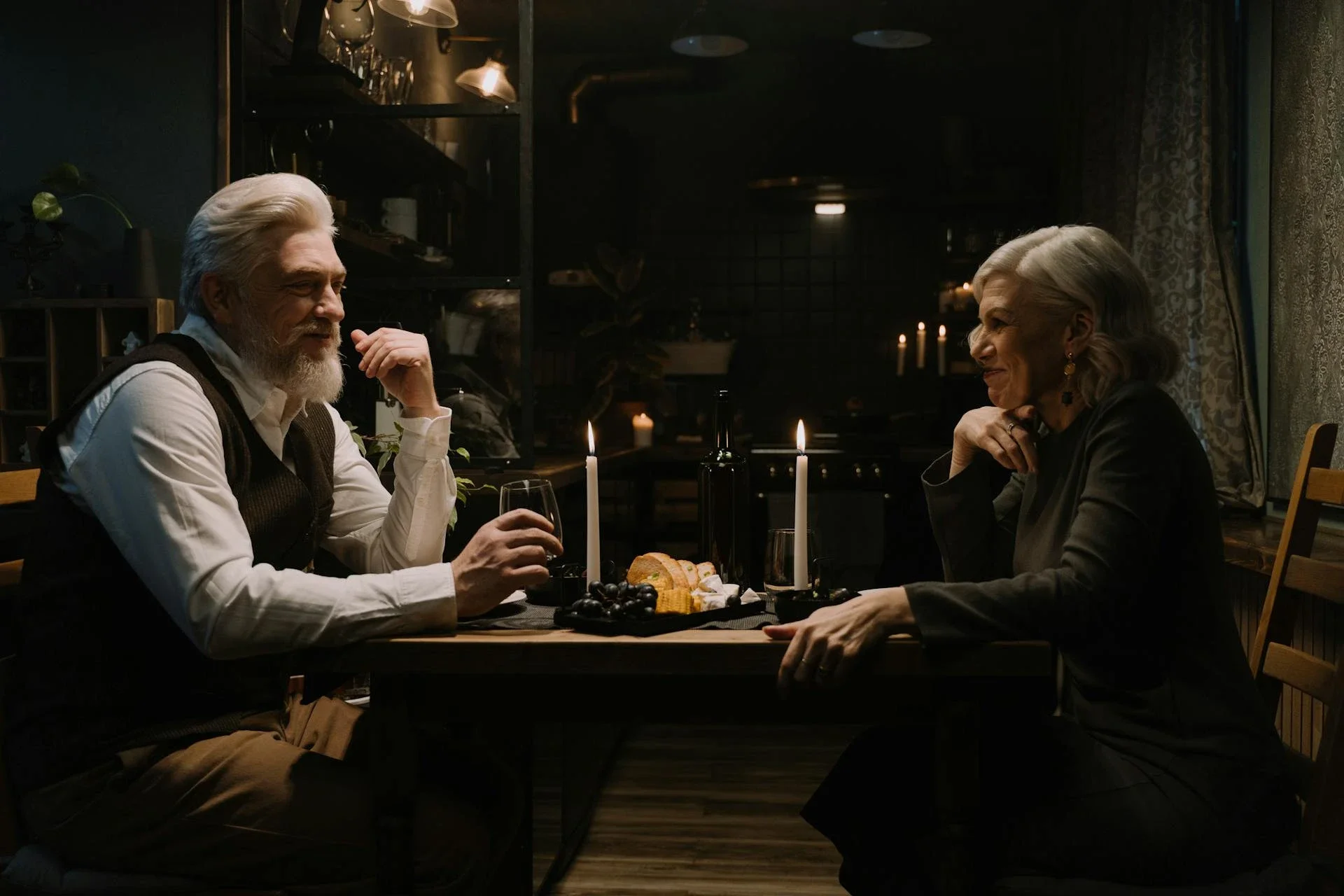 a heterosexual mature couple celebrate Valentines Day meal.