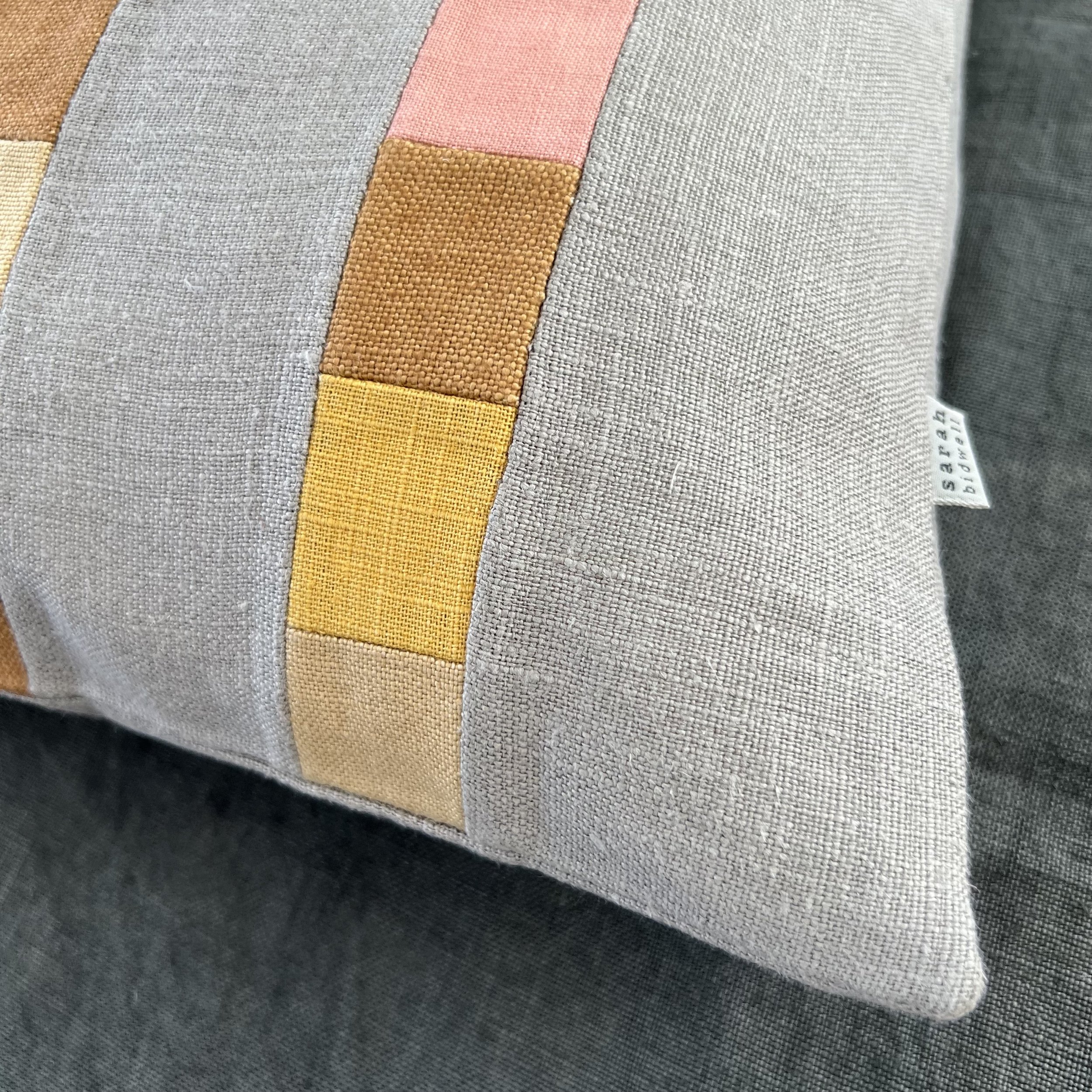 square version of rectangular cushion with lines of squares detail.jpeg
