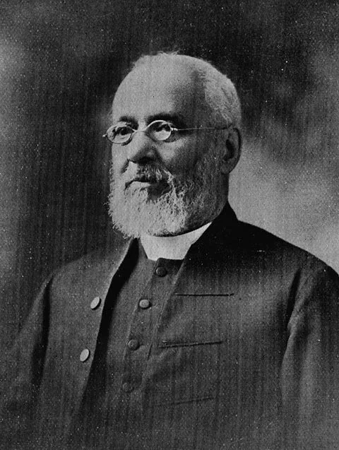 portrait of an older gentleman with a full white beard