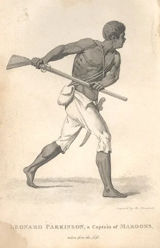 black and white image of a black man running with a rifle