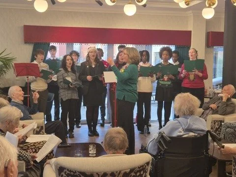Hark! The jolly choir sings! DGS singers visit local care home