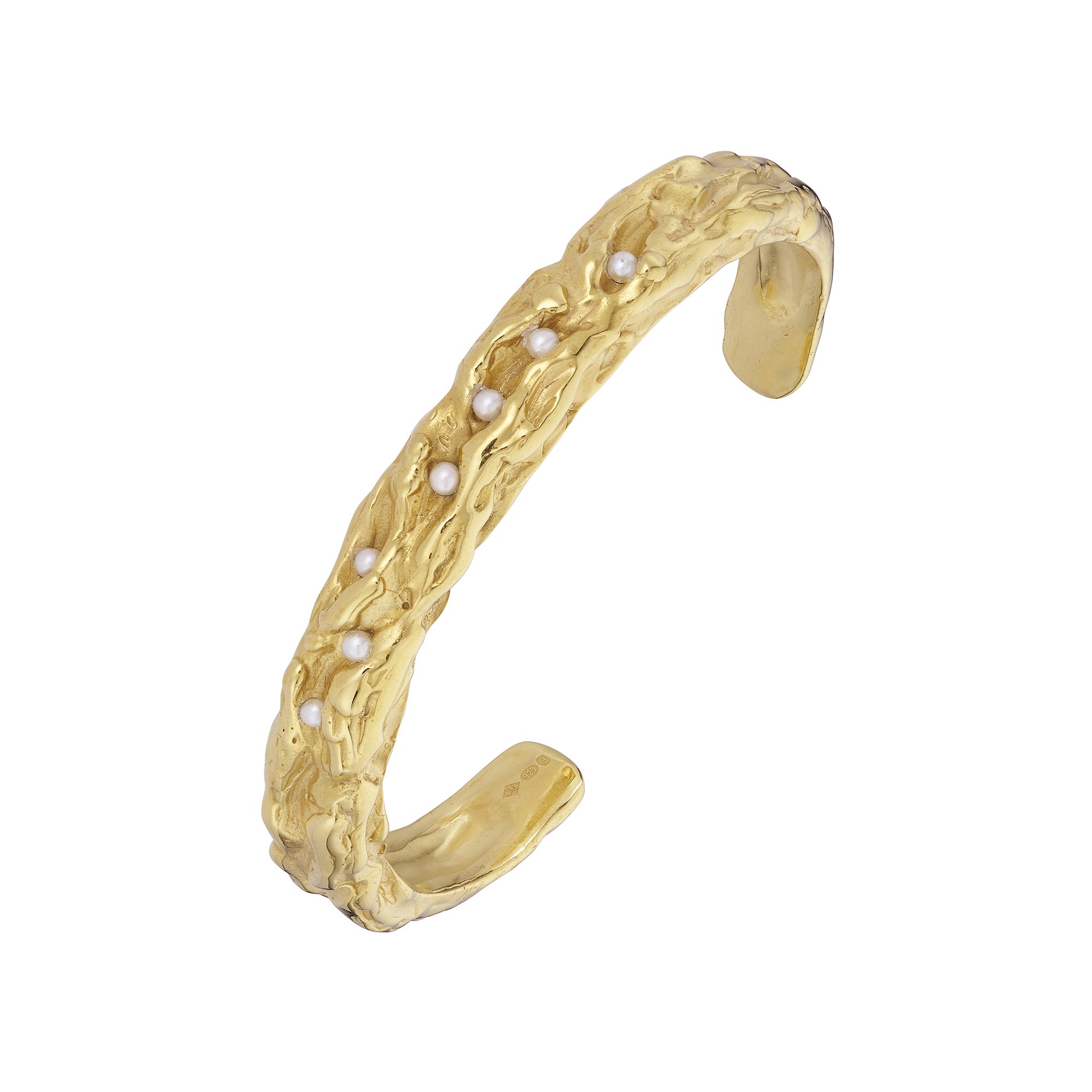 Clare Maiden Storm bangle in textured gold vermeil inlaid with seven cultured pearls, angled view