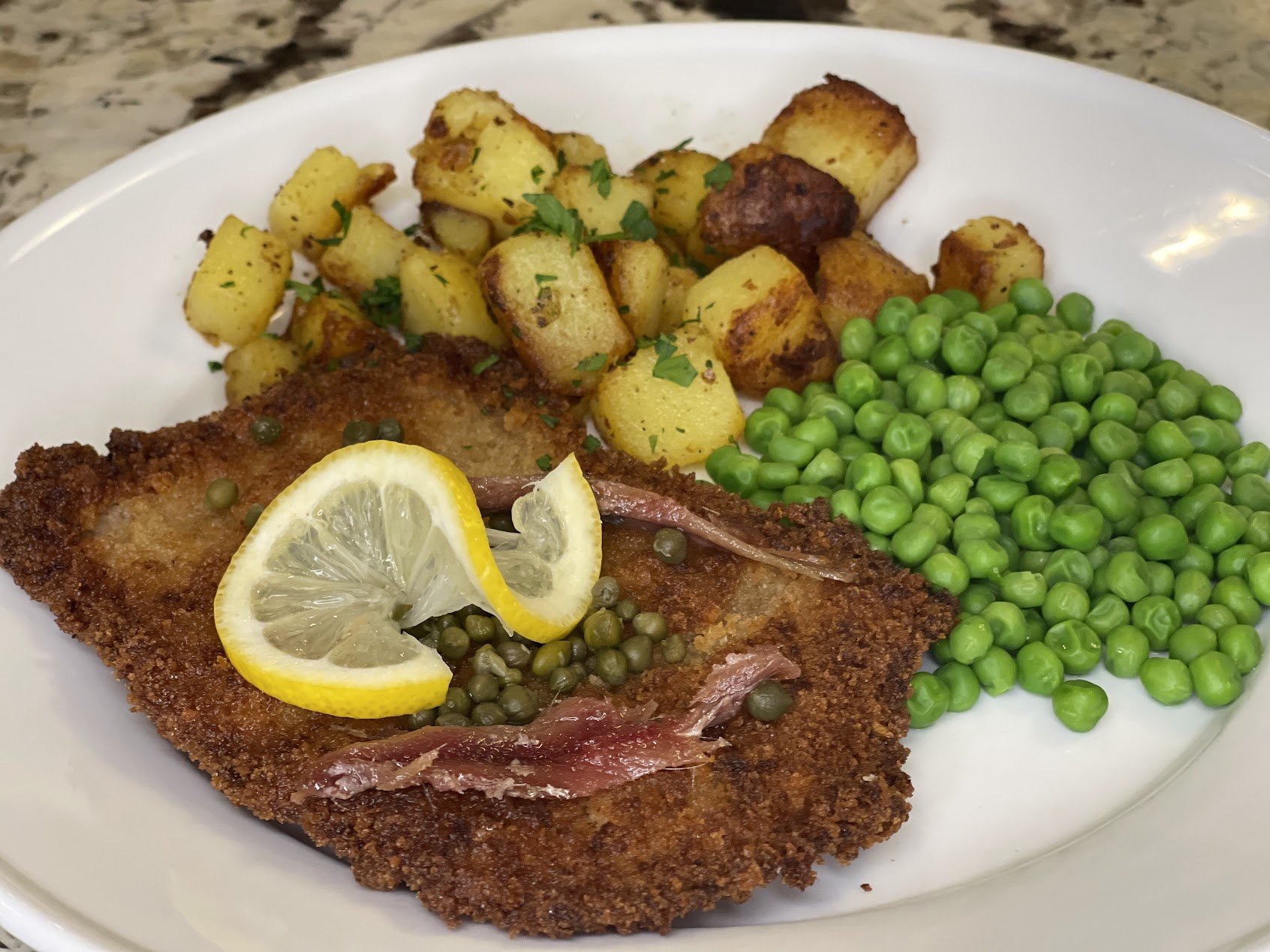 Schnitzel with Pan Fried Potatoes and Peas