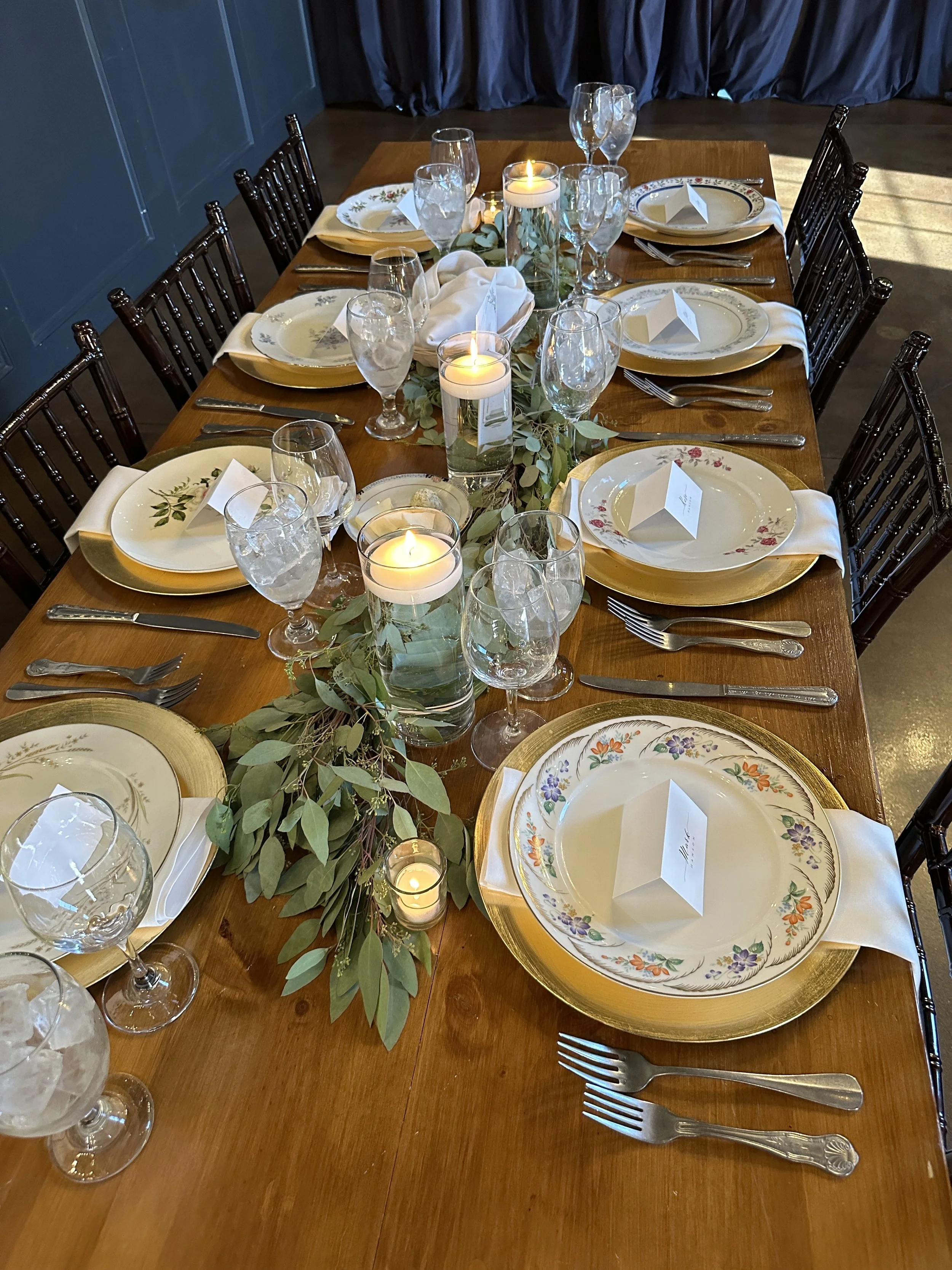 Assorted cylinders with floating candles