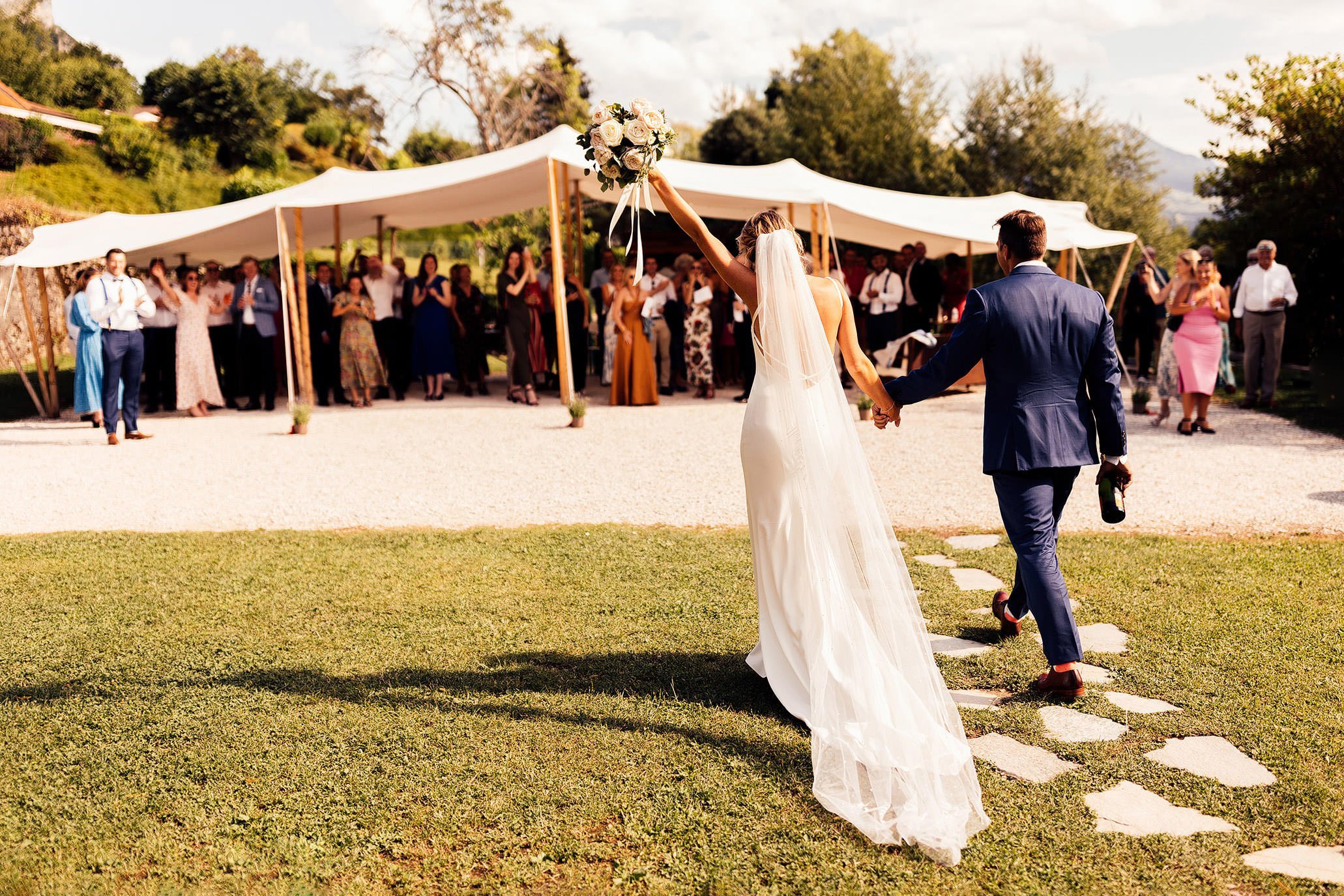 couple enter sperry tent marquee at south of France wedding 