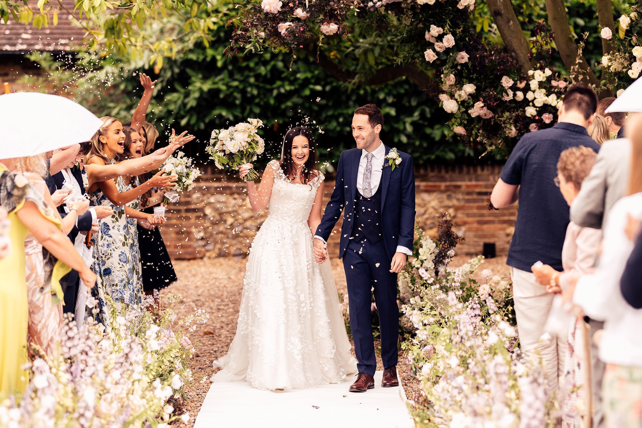 confetti moment at couples at home outdoor wedding ceremony