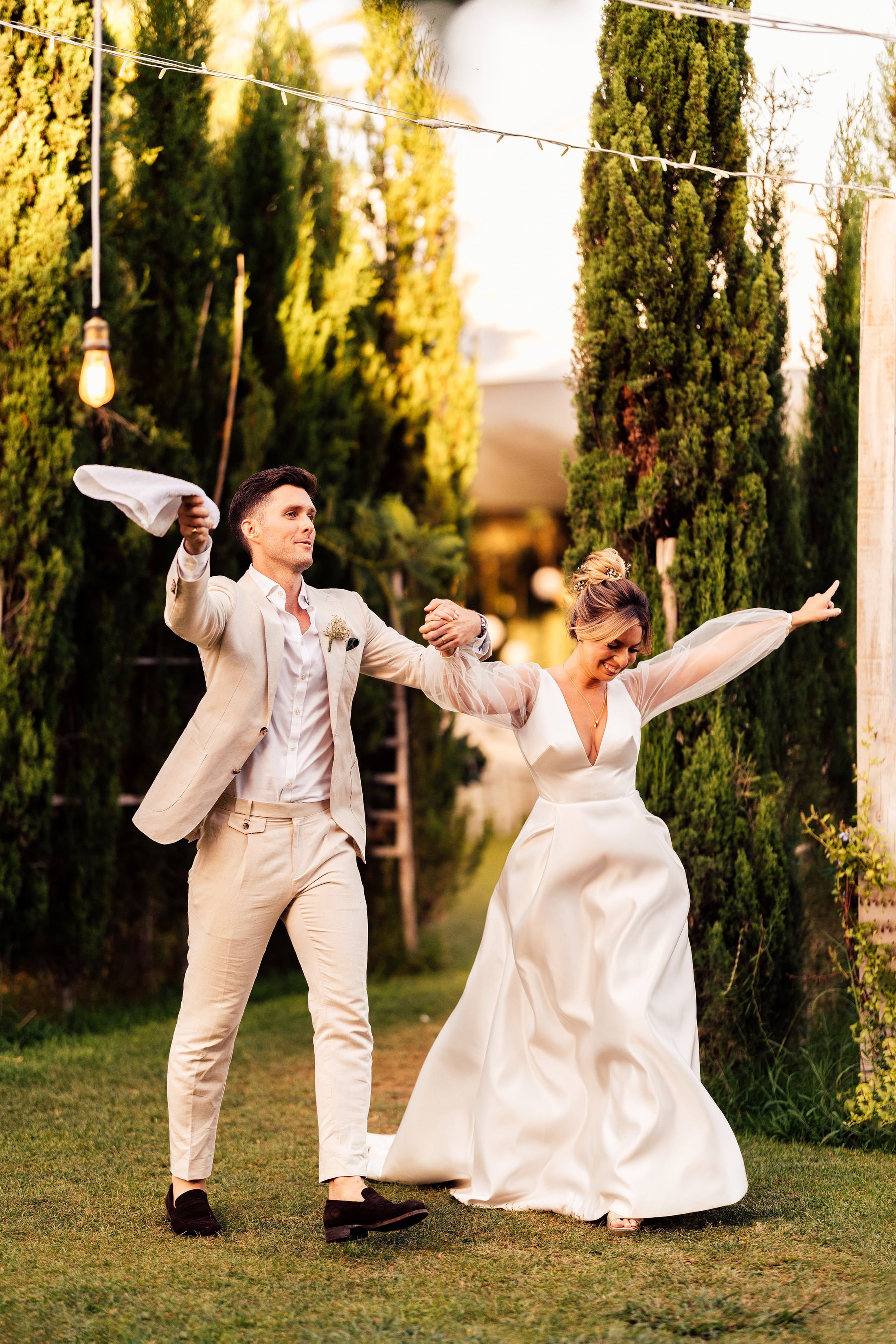 couple enter finca monasterio wedding reception