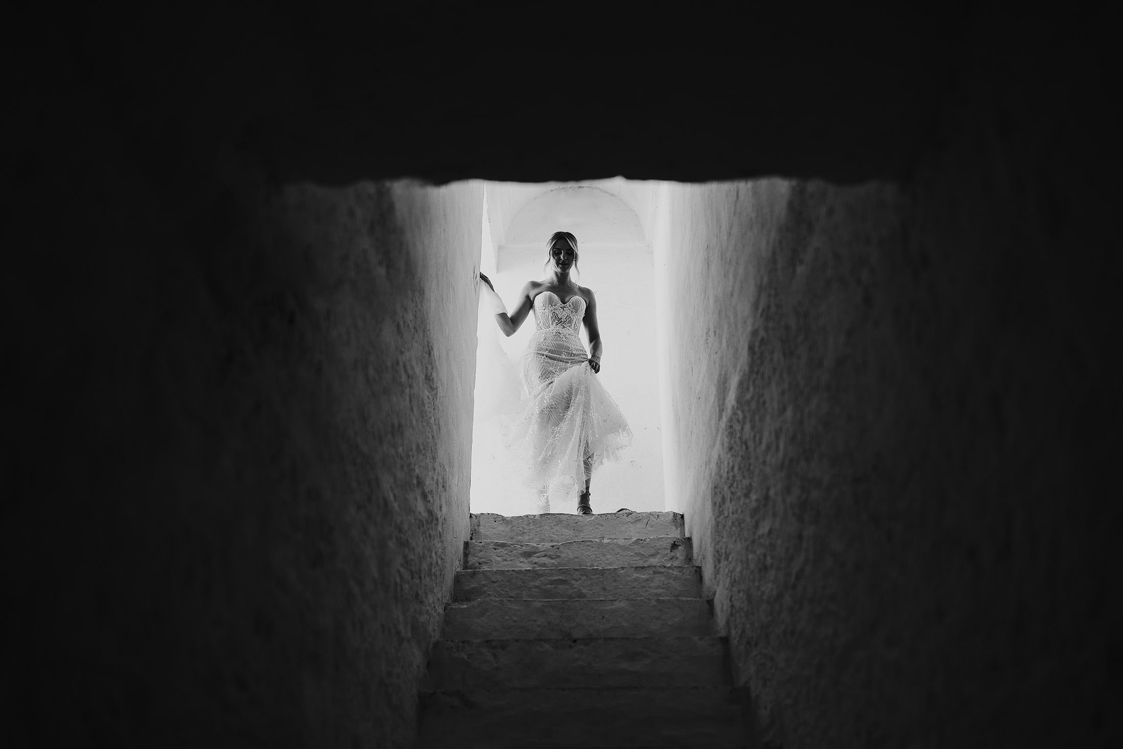 bride walks down stairs in galia lahav dress