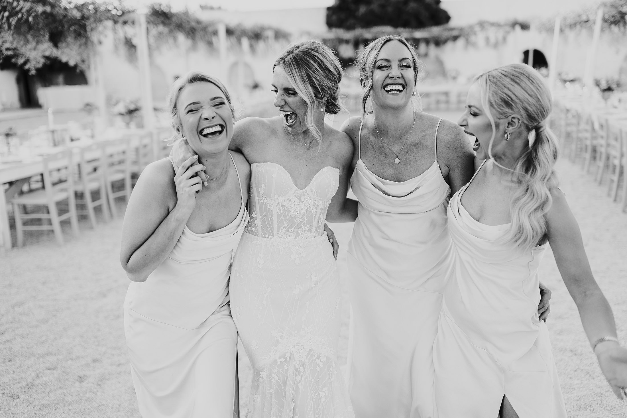 bride laughs with bridesmaid in Puglia wedding venue