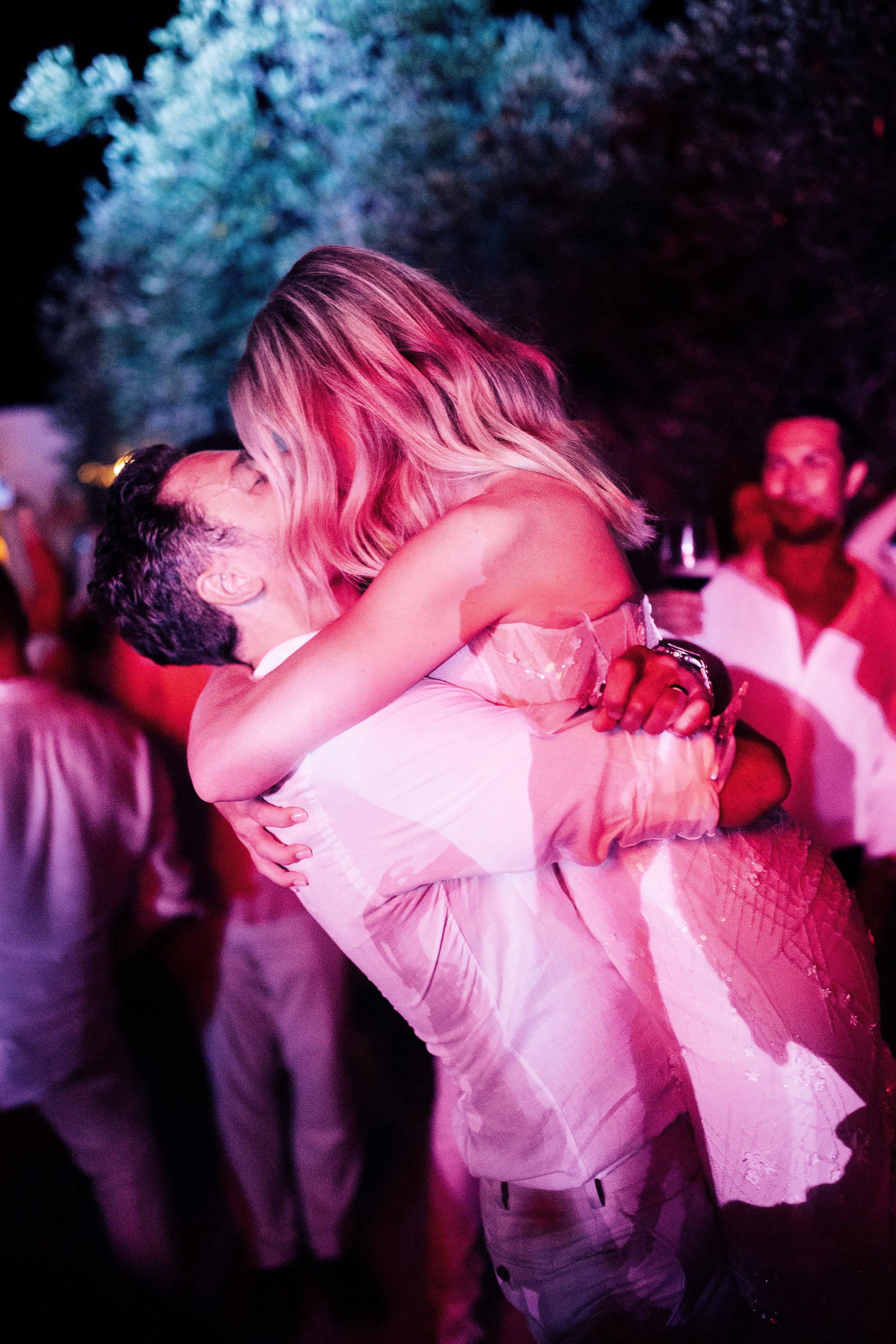 couple embrace on dance floor at Puglia wedding venue