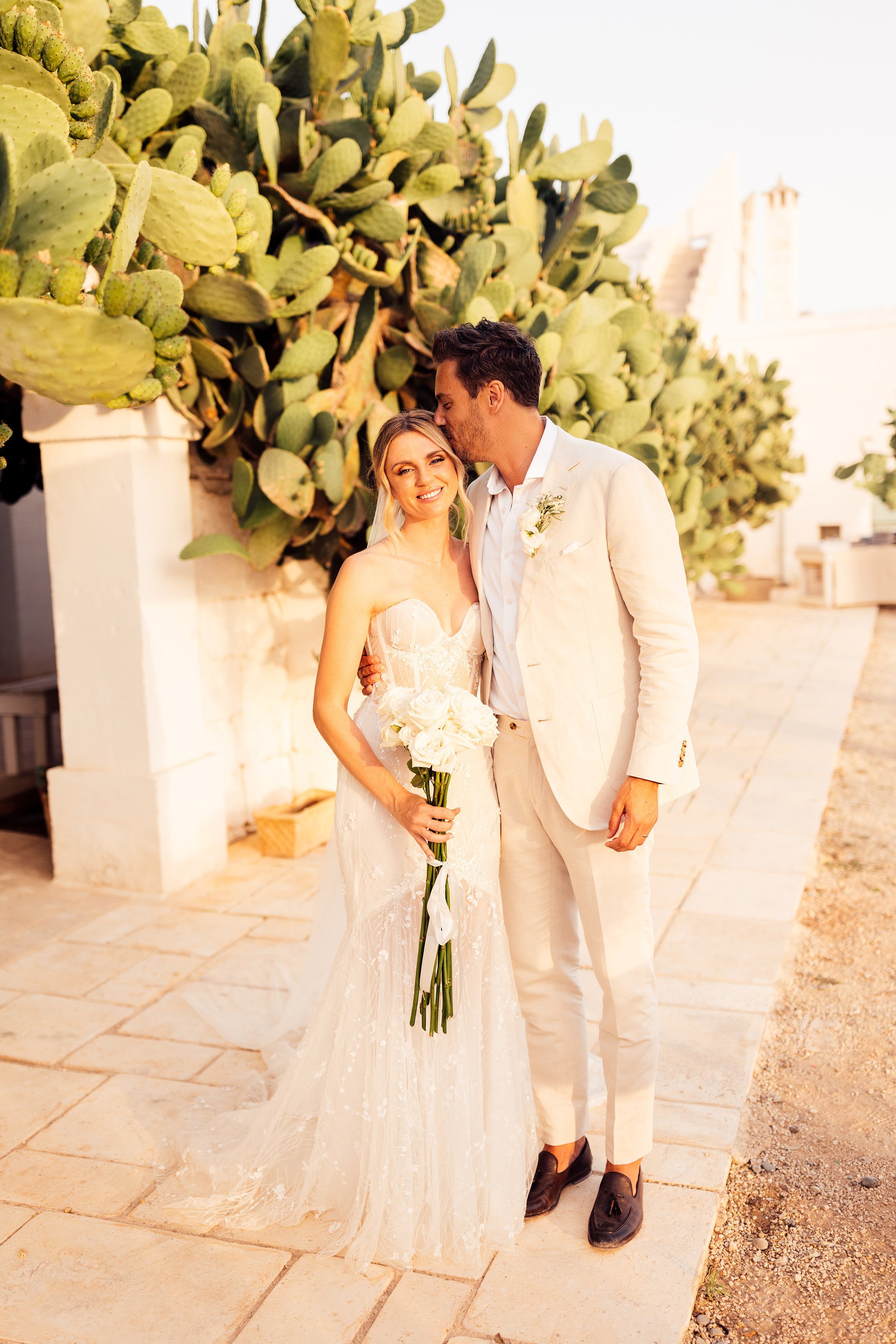 couple portrait in front of cactus in Puglia wedding venue masseria potenti