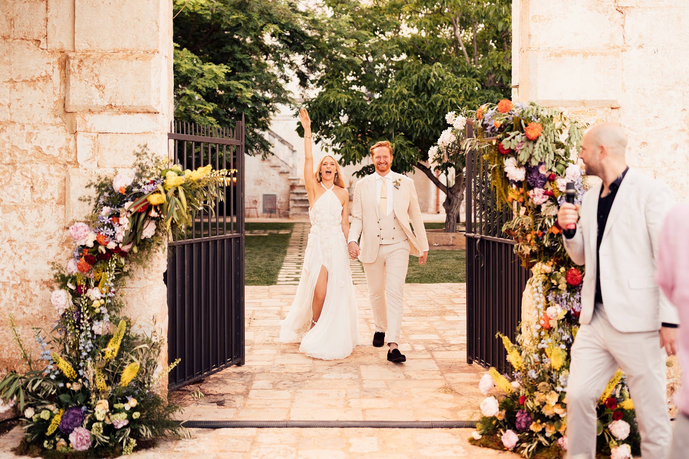 couple enter wedding reception at masseria mangiamuso