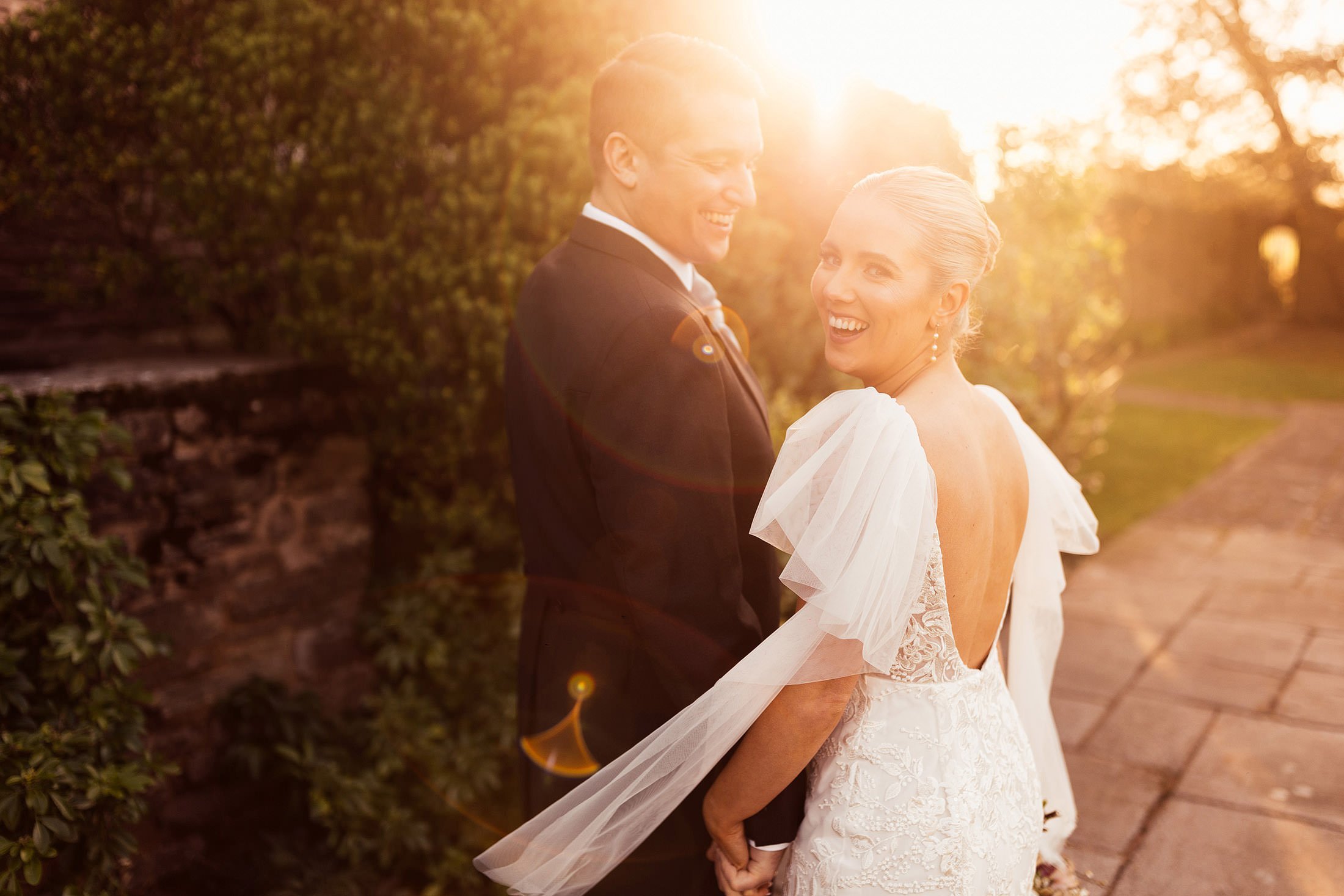 couple laugh in sunset at dewsall court
