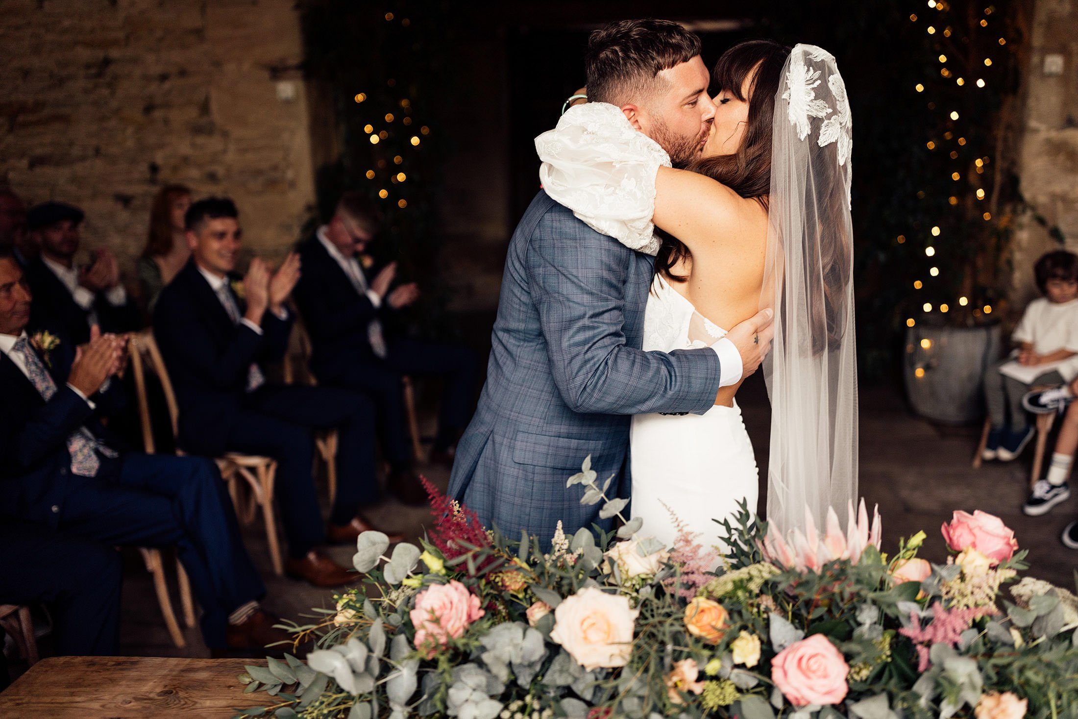 couple share first kiss at Cripps stone barn