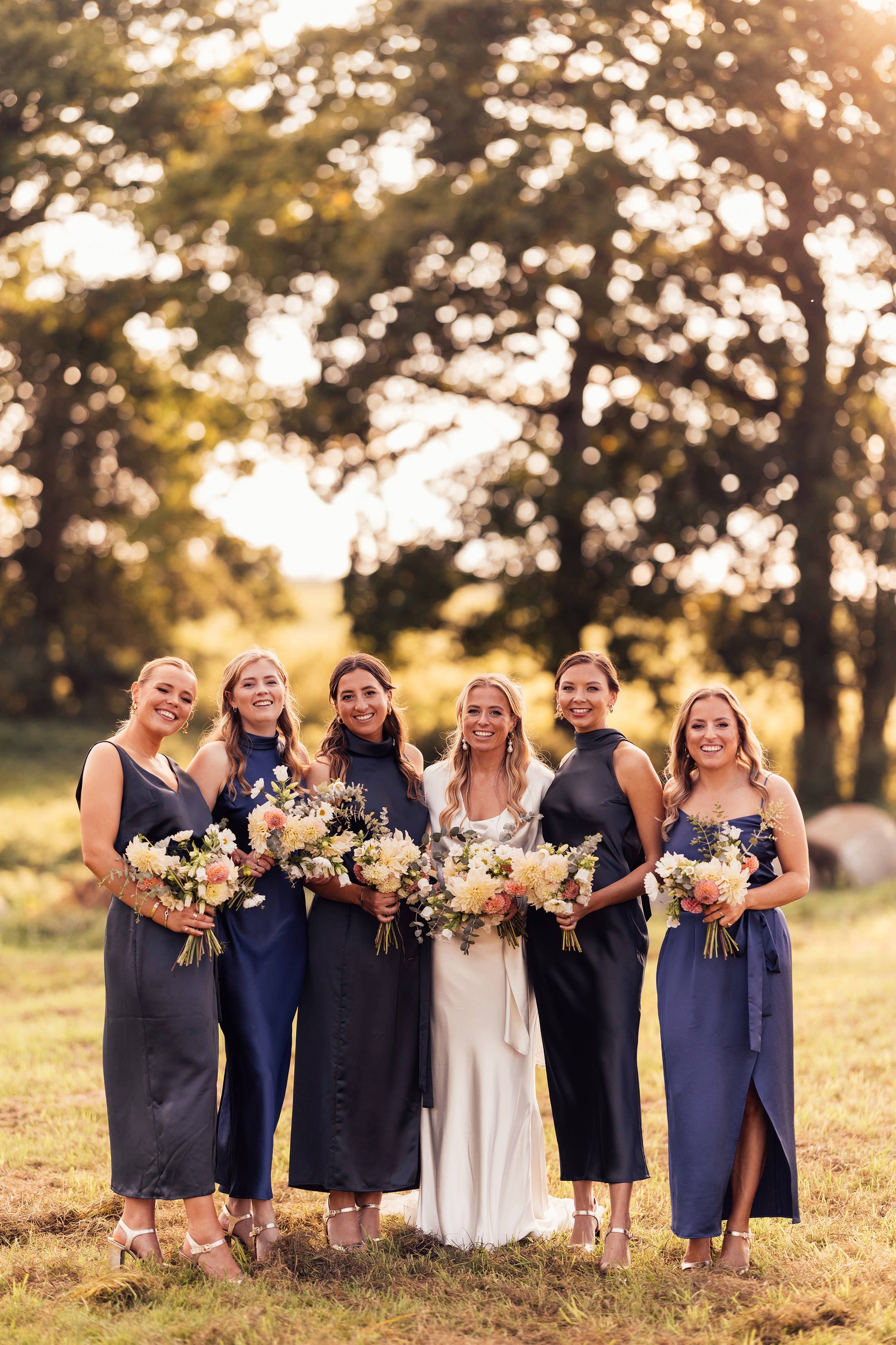 bridal party with dresses by the own studio