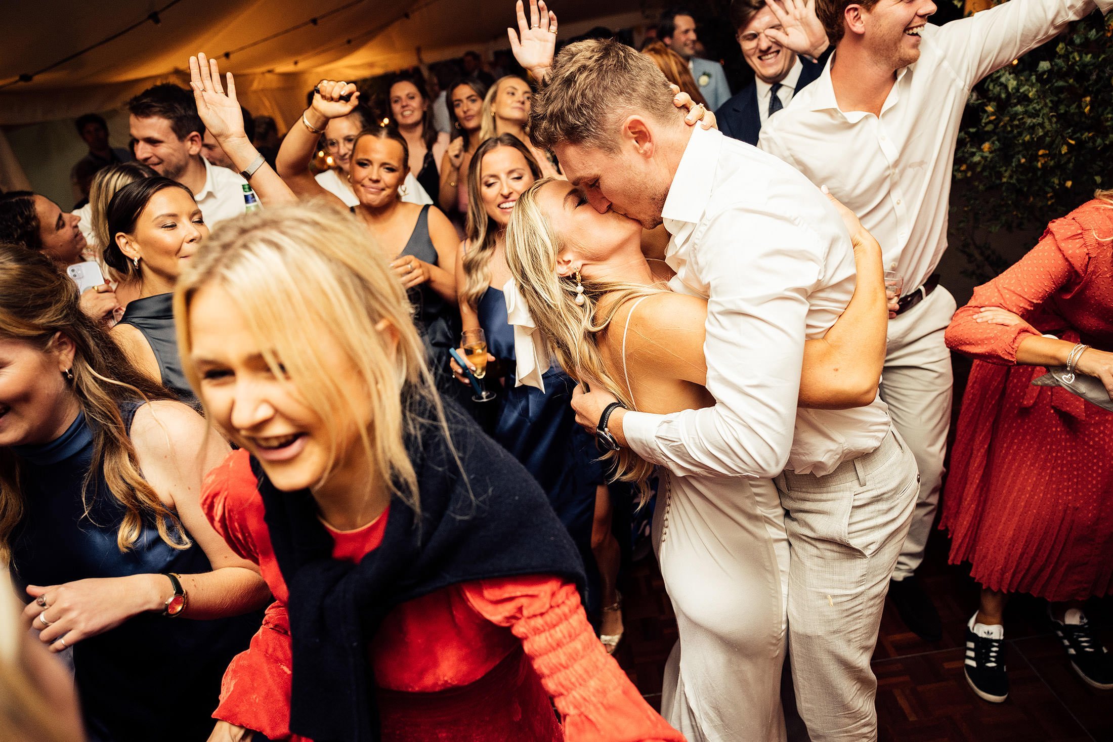 couple embrace on dance floor in marquee 