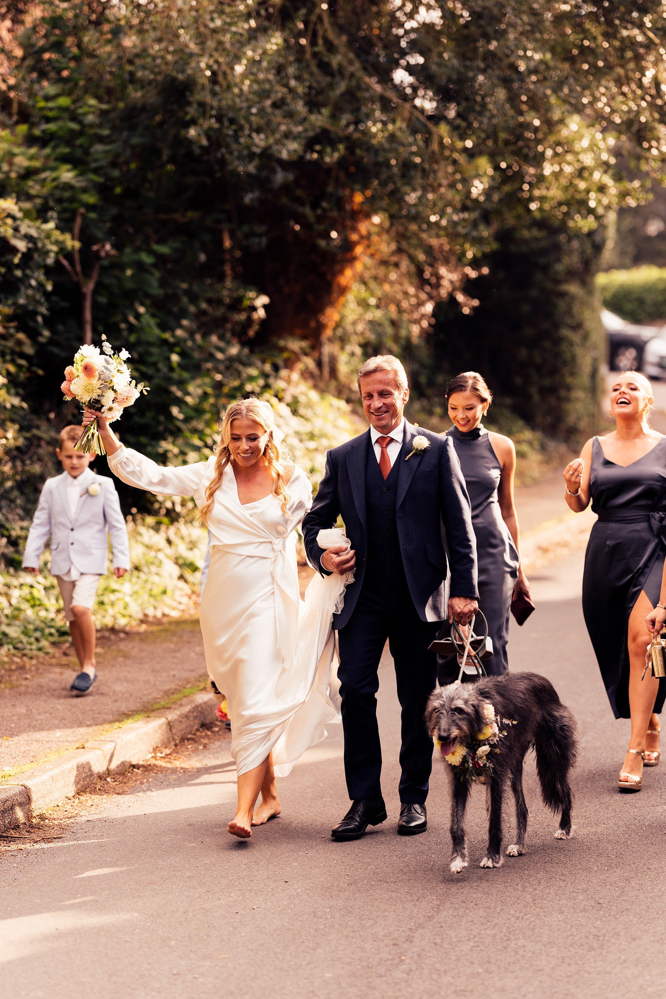 bridal party walk in street barefoot
