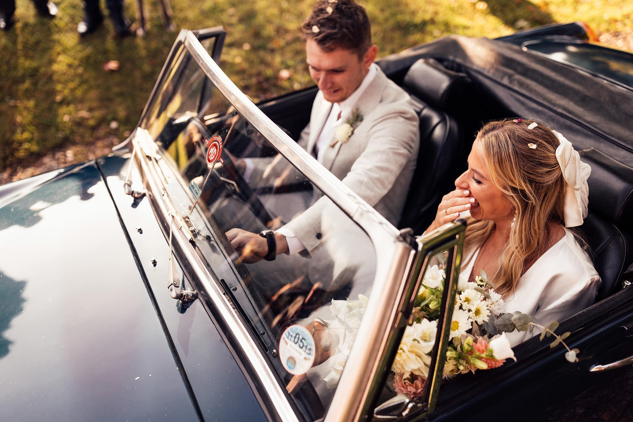 groom tries to start vintage car