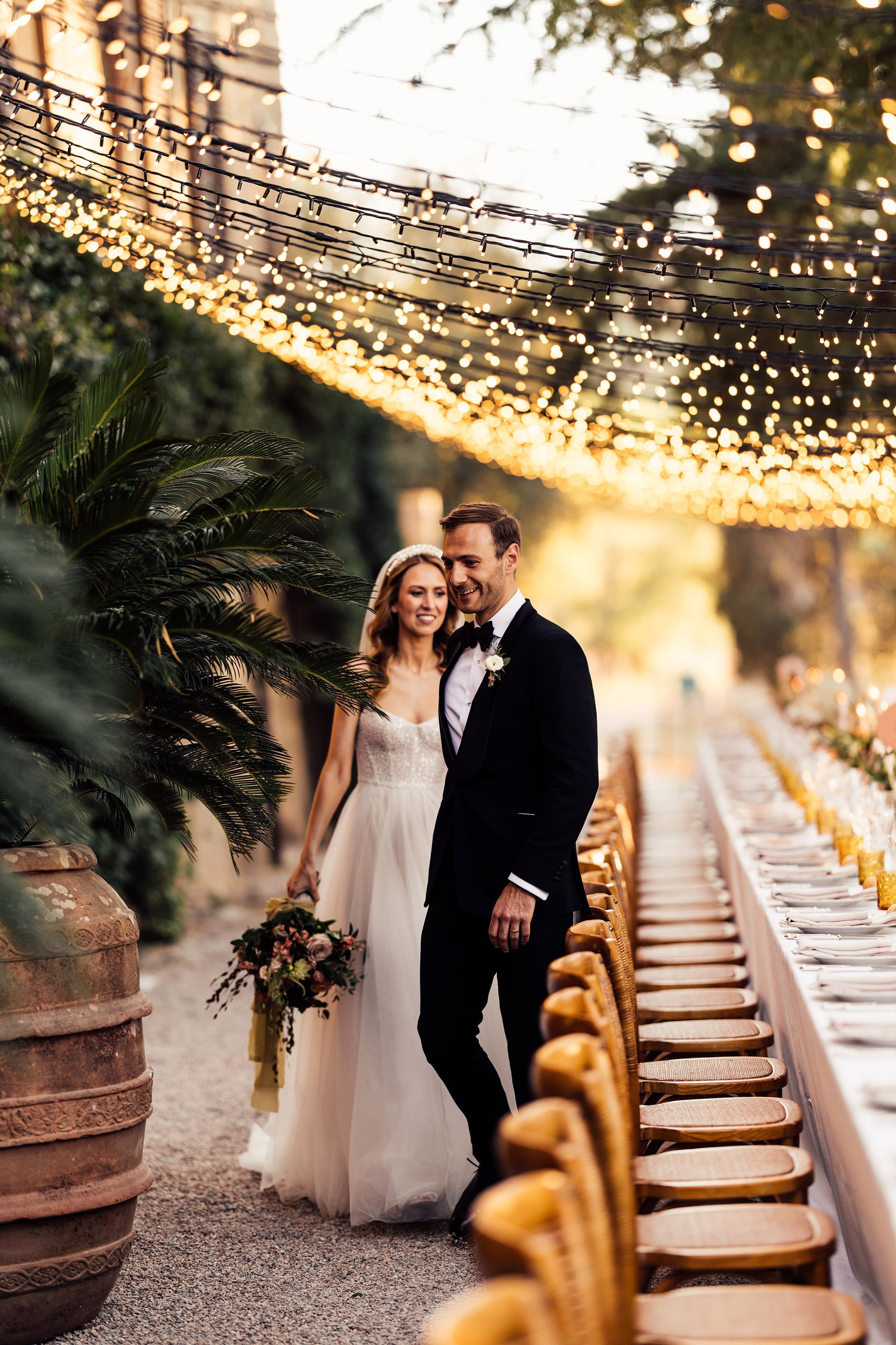 bride and groom walk through table set up at la Pescaia resort