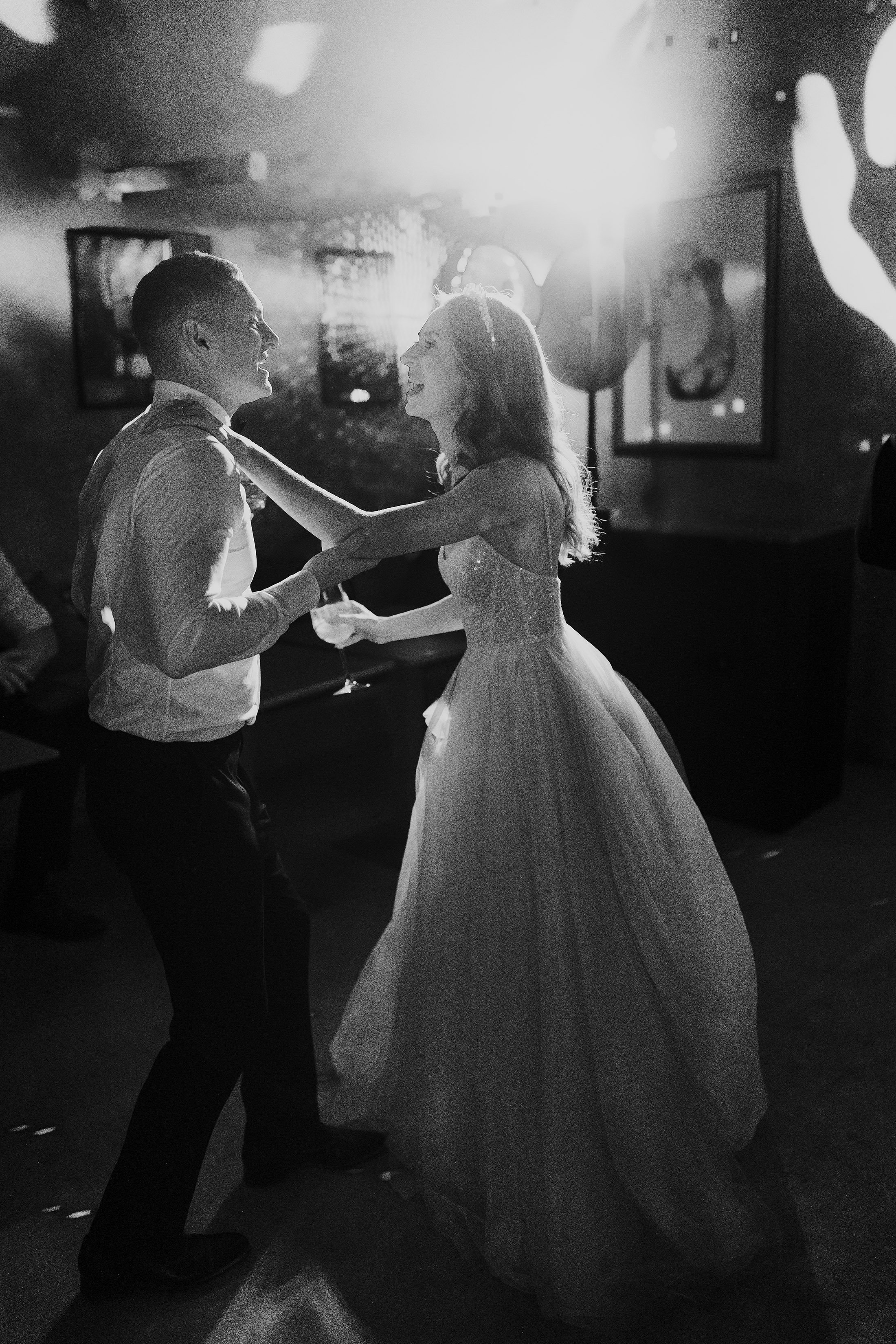 bride dances with guest at la Pescaia resort