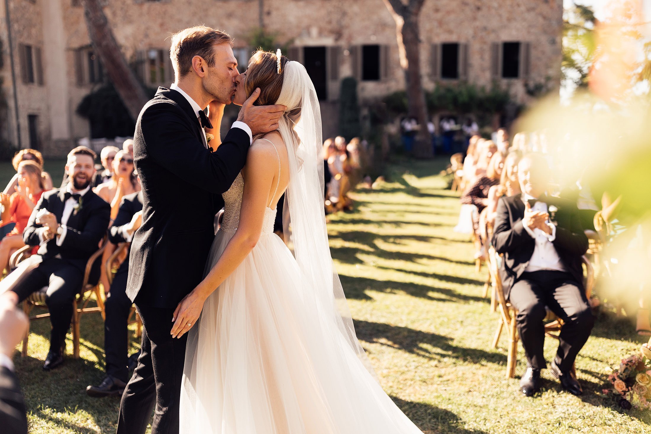 couples first kiss in outdoor ceremony at la Pescaia resort