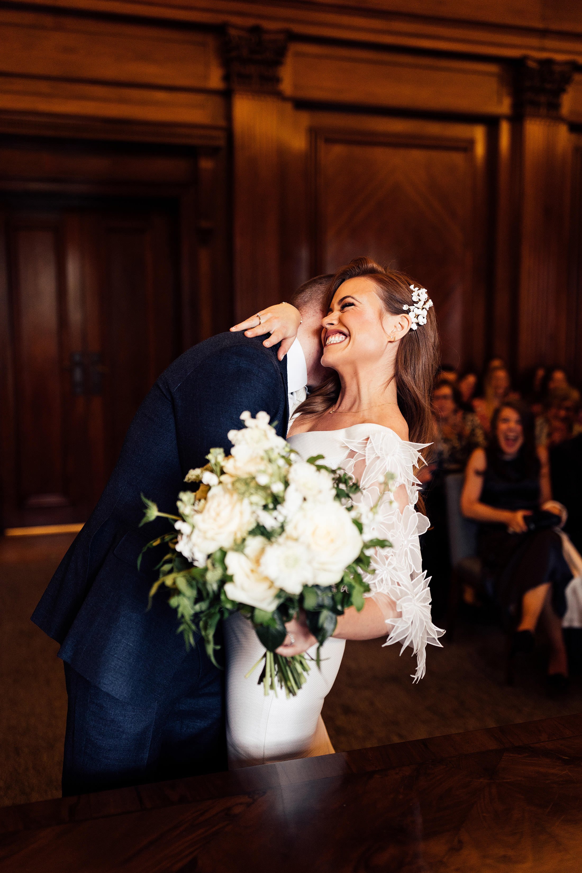 couple embrace at Marylebone town hall ceremony