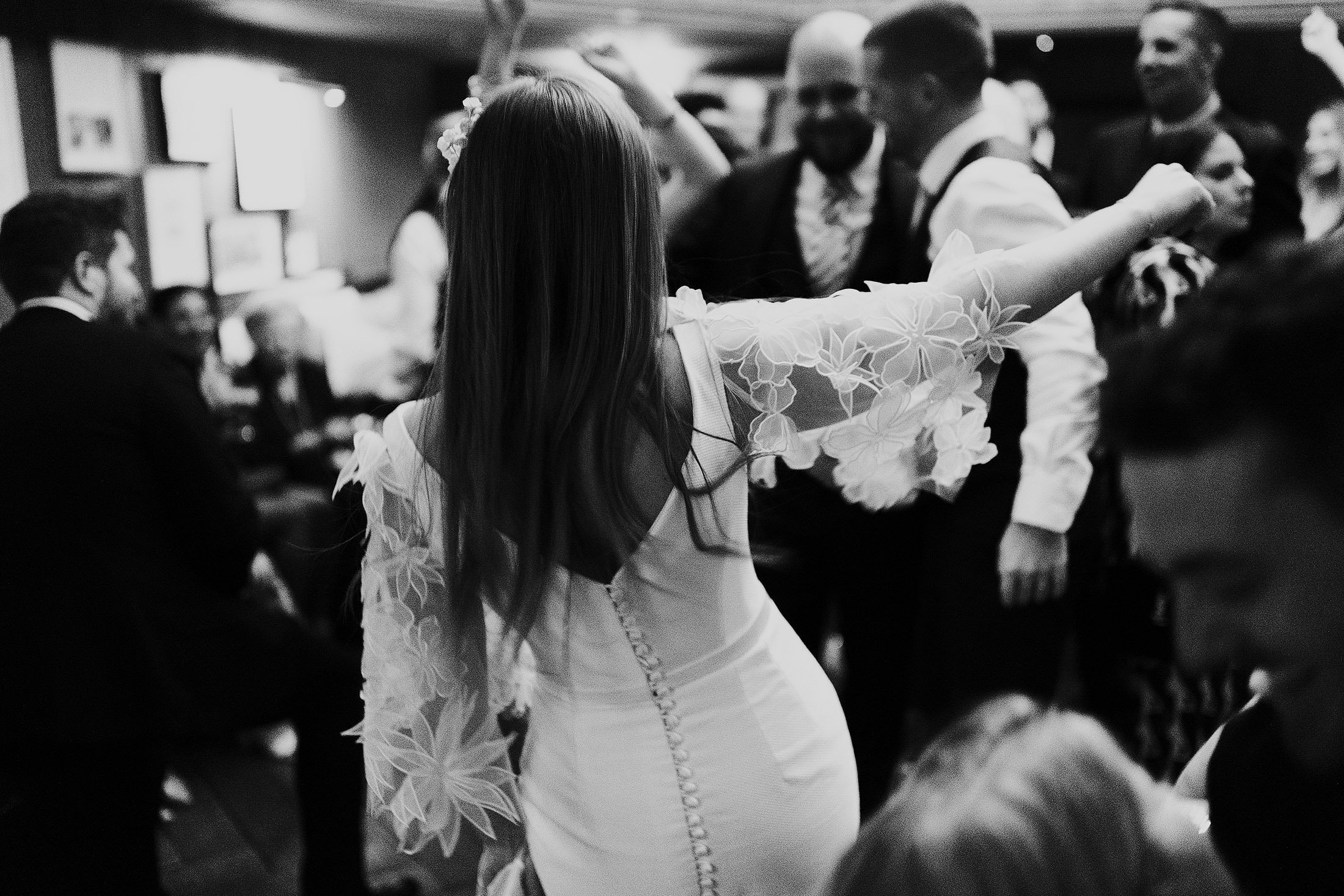 bride in suzanne neville dress dancing in the ned London