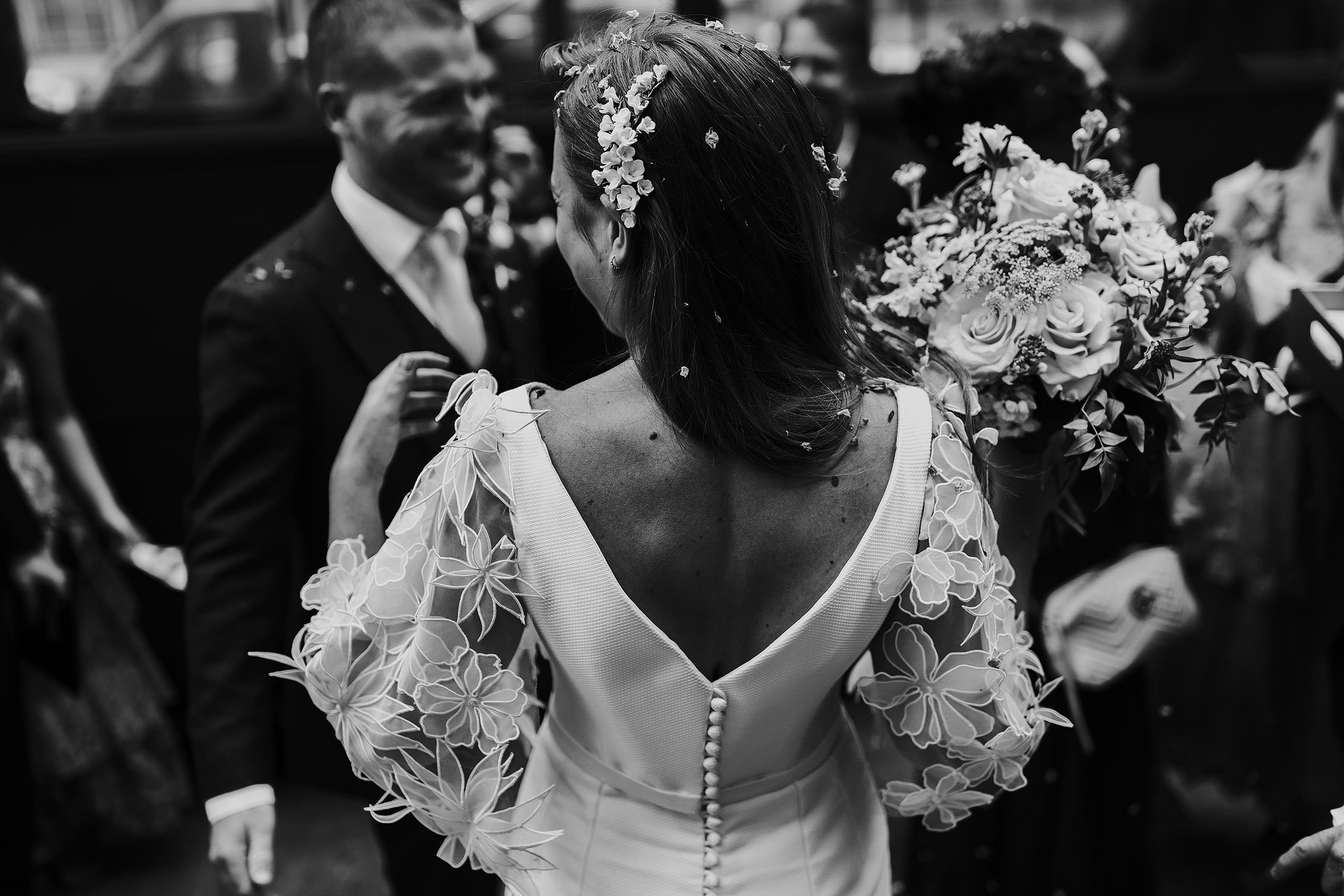 bride with confetti in hair and eden b studio hairpiece 