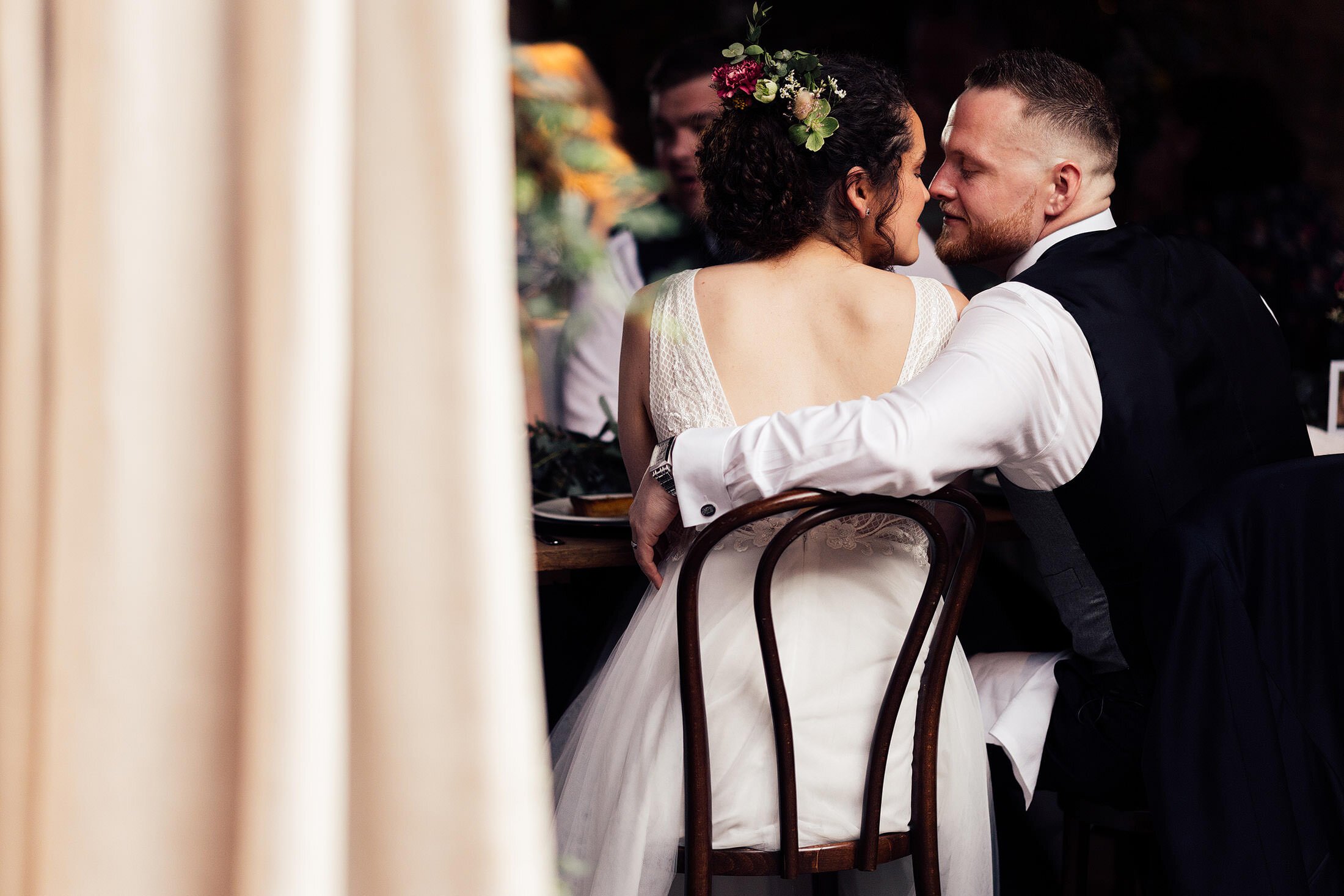 couple kiss at dinner table Cripps barn