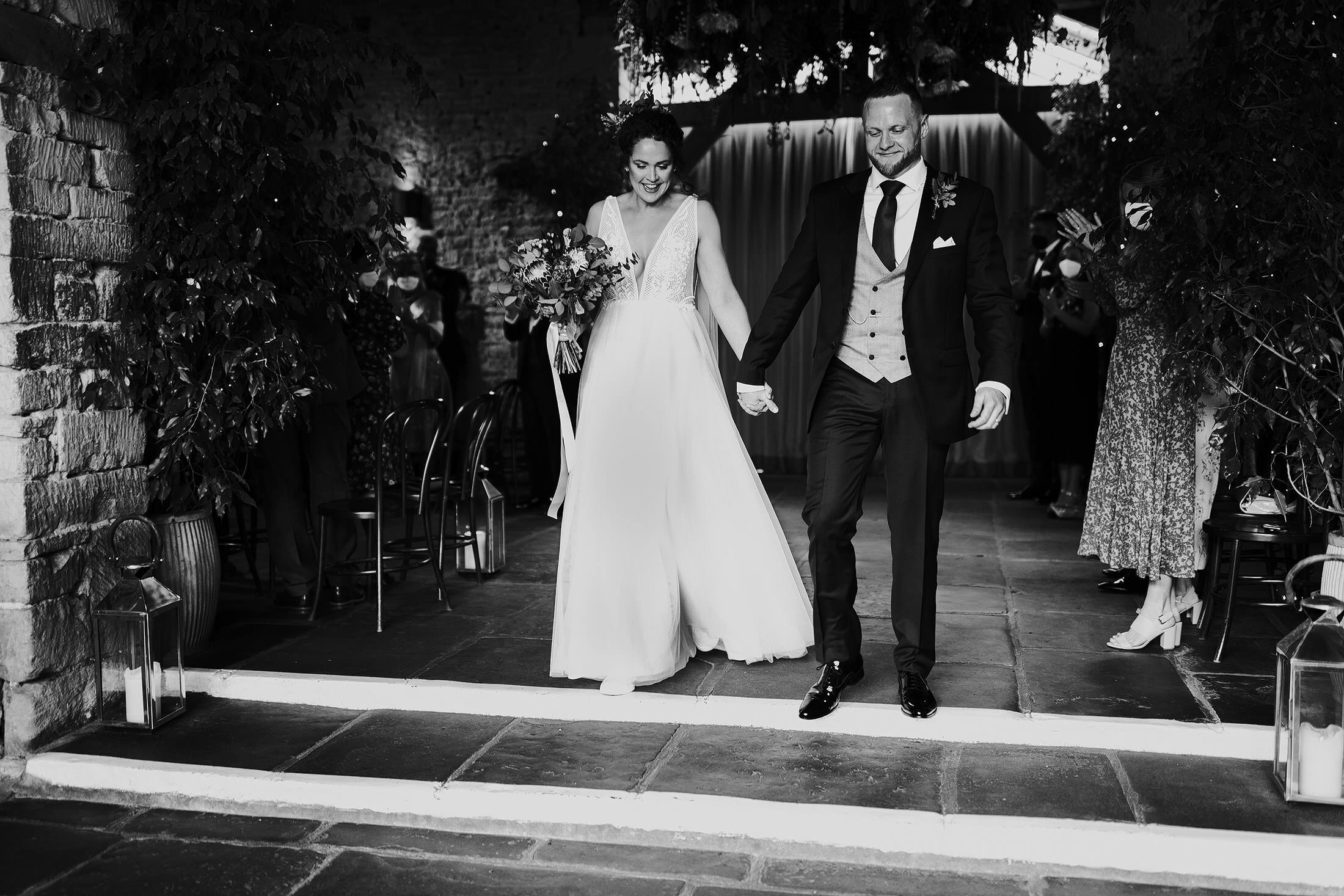 couple exit Cripps barn ceremony 