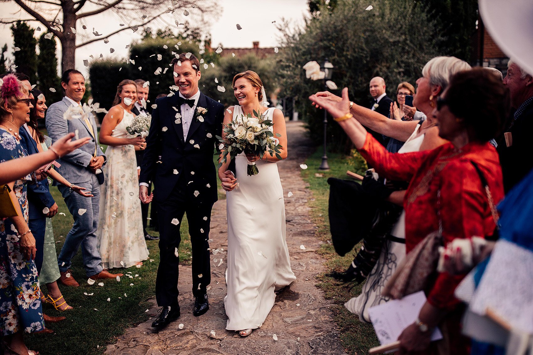 confetti moment with bride in pronovias wedding dress