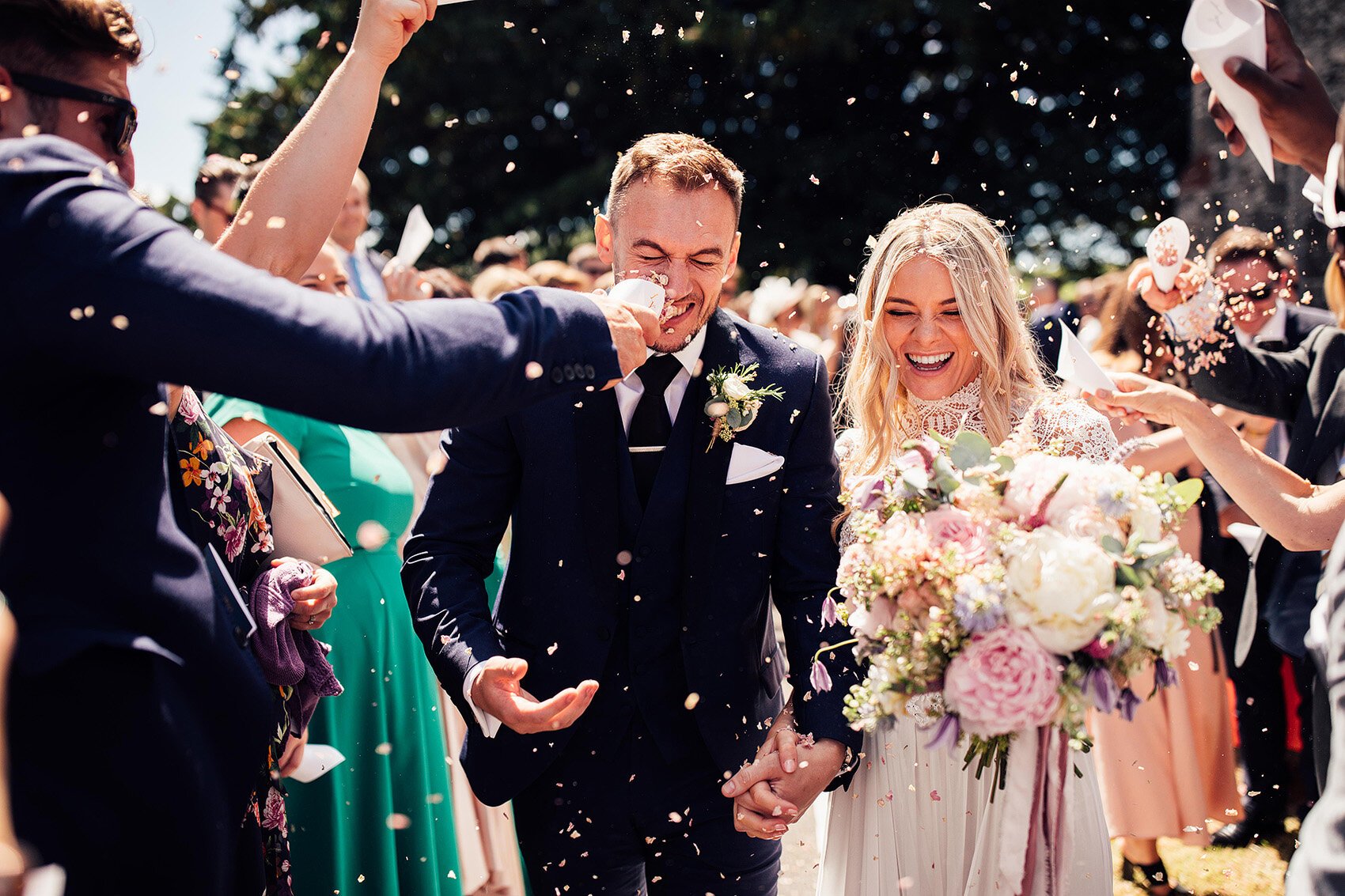 Confetti moment by Harry Michael Photography for wedding with outdoor first dance