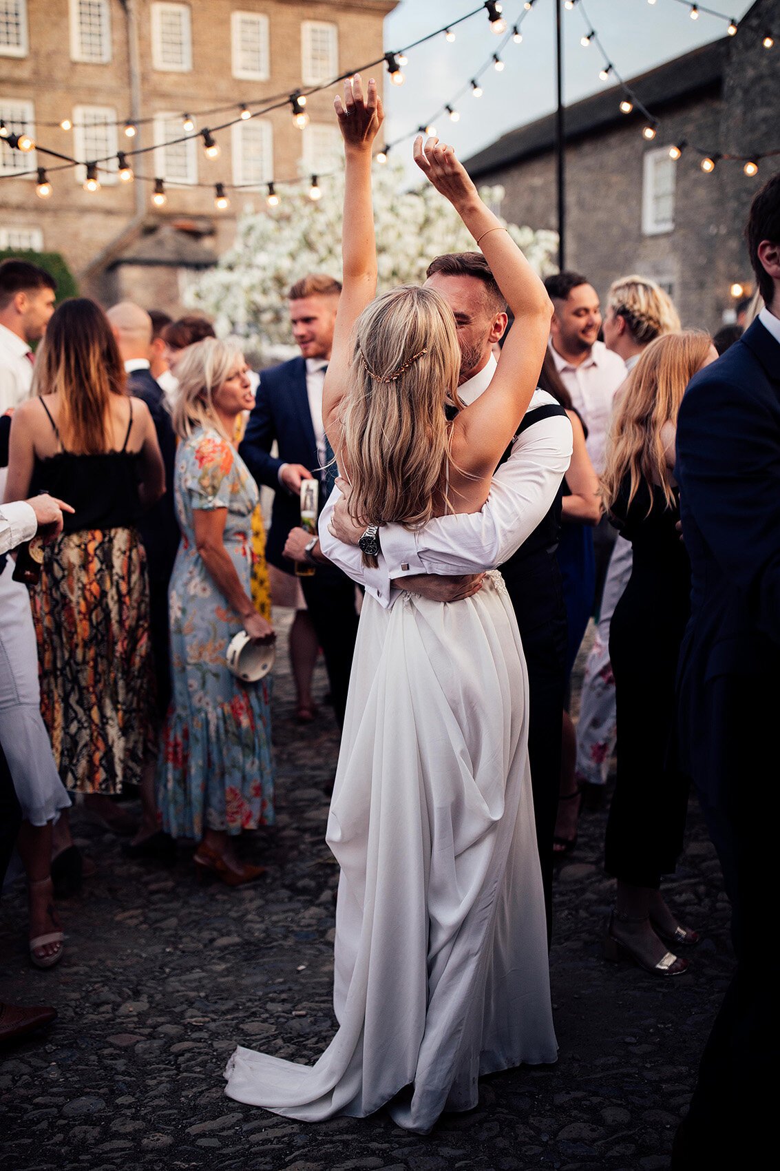 Bride in Julio Vino wedding dress for outdoor wedding first dance