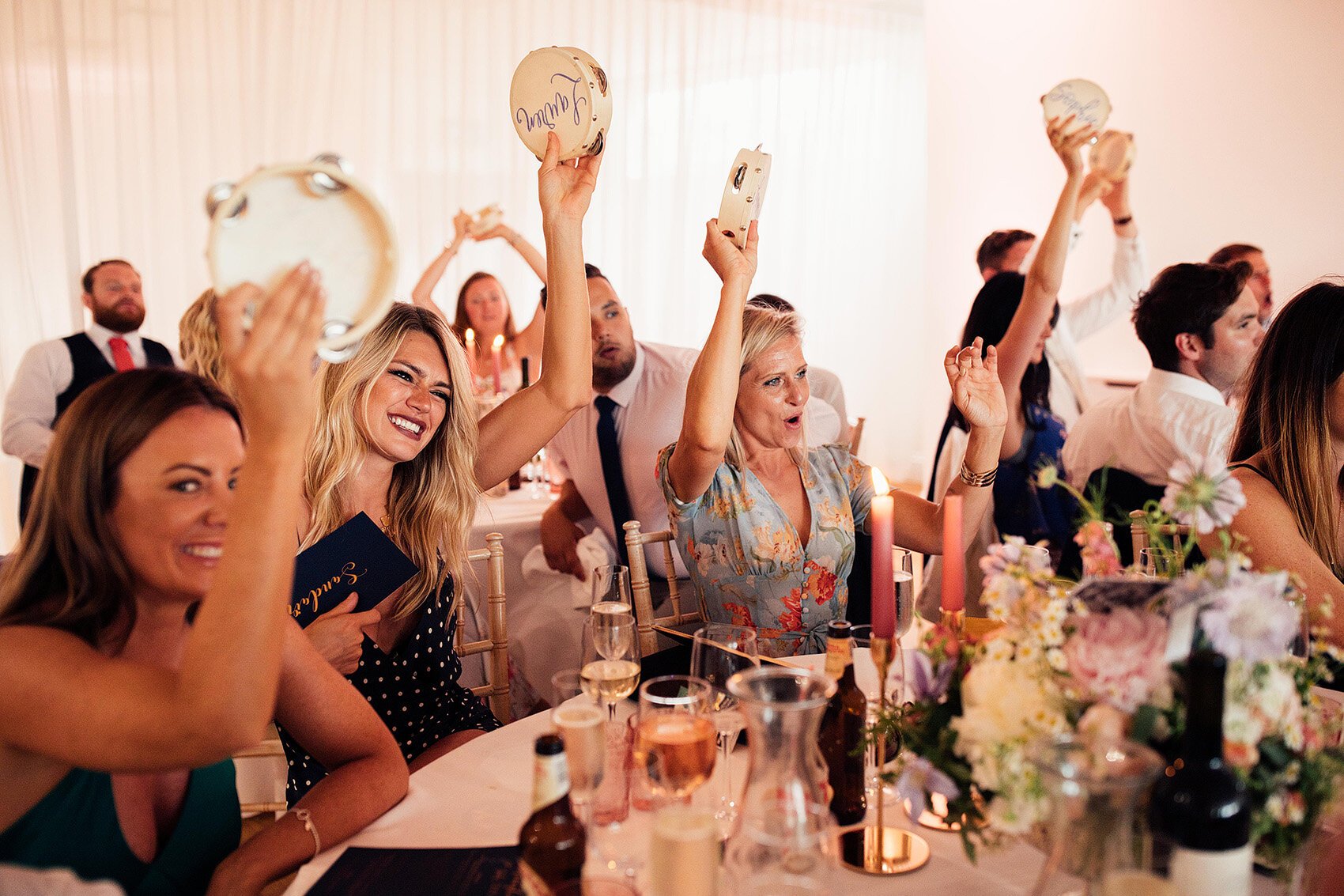 Wedding guests shaking their Tamborine wedding favour