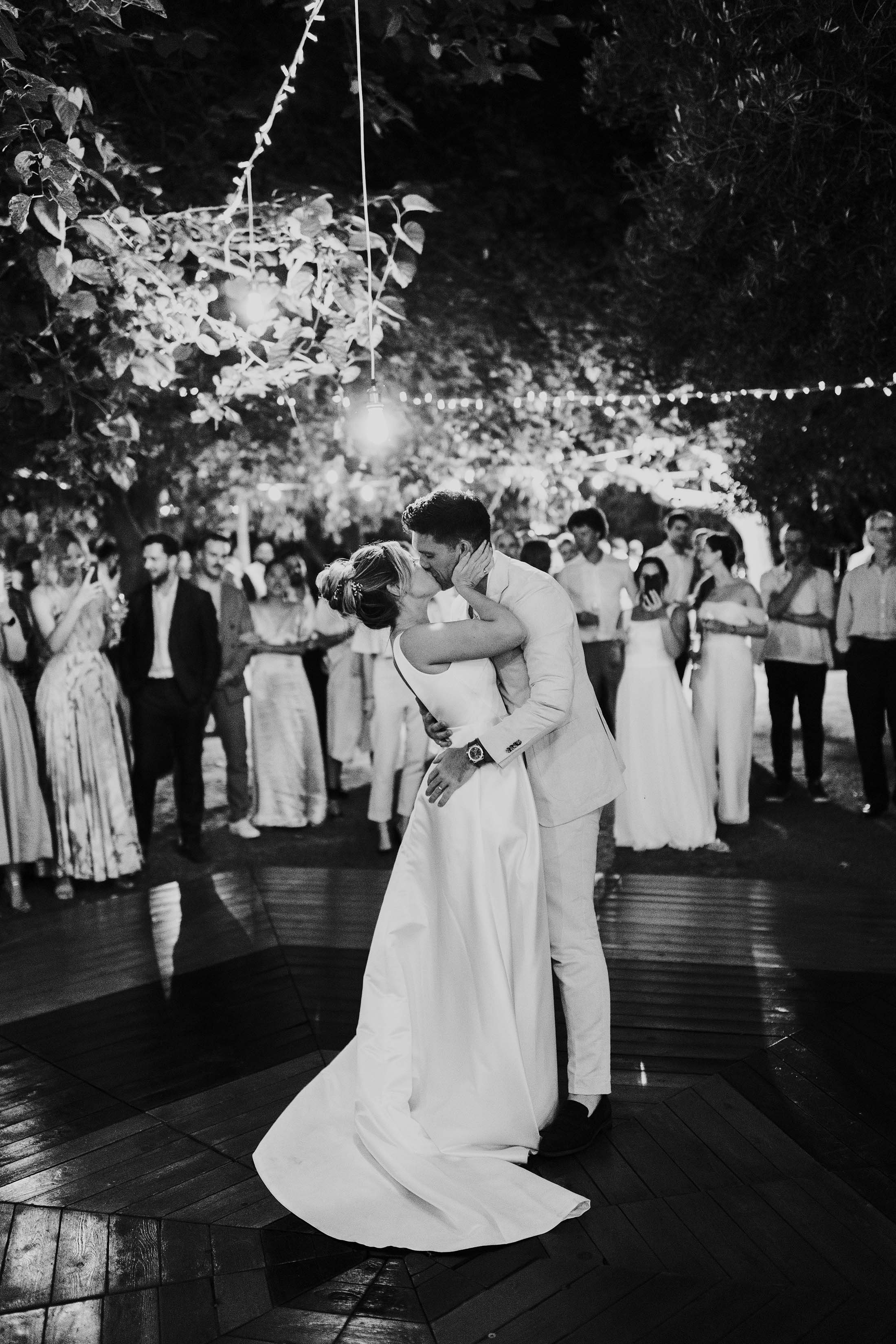 black and white photo of bride and groom performing outdoor first dance at finca monasterio