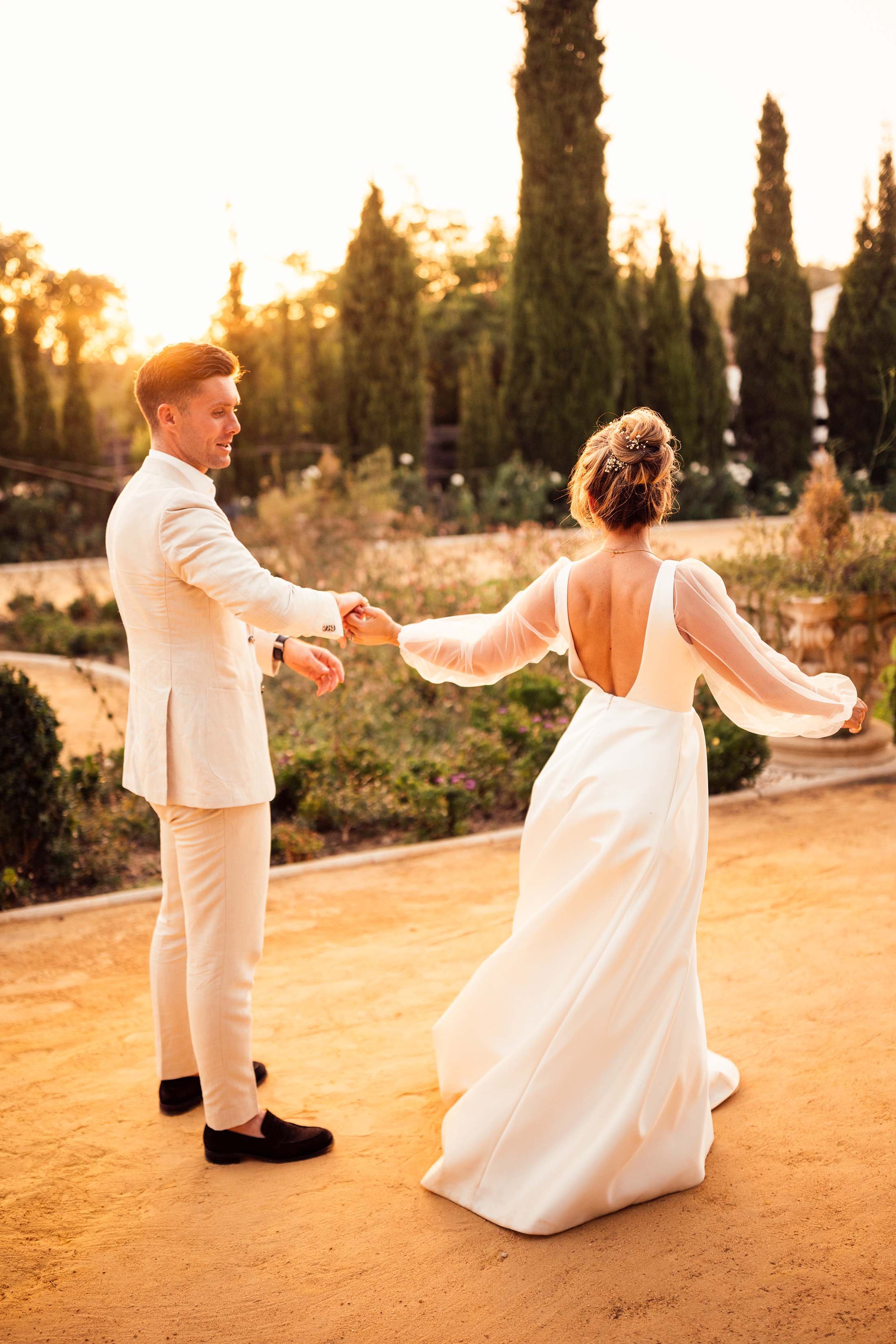 bride and groom dance at sunset in finca monasterio grounds