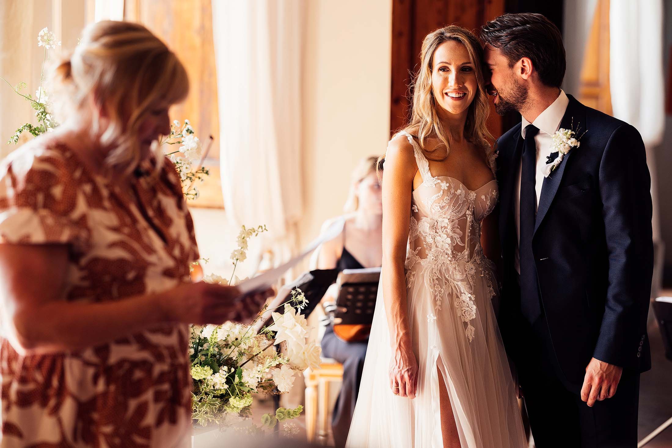 couple share moment during italian wedding ceremony in villa di ulignano ballroom