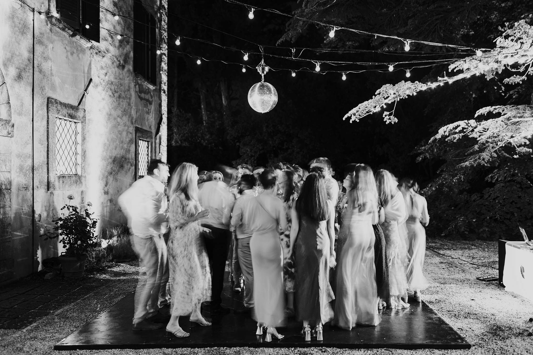black and white photo of guests on dancefloor 